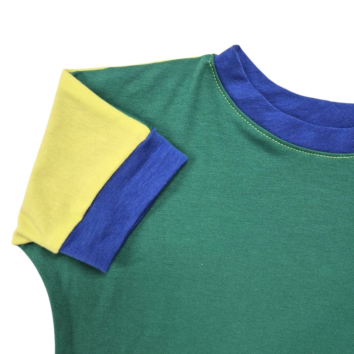 Multi colored grow-with-me t-shirt for kids, made from soft organic cotton with a stretchy, foldable waistband. Ethically made in Canada for a sustainable and comfy fit.