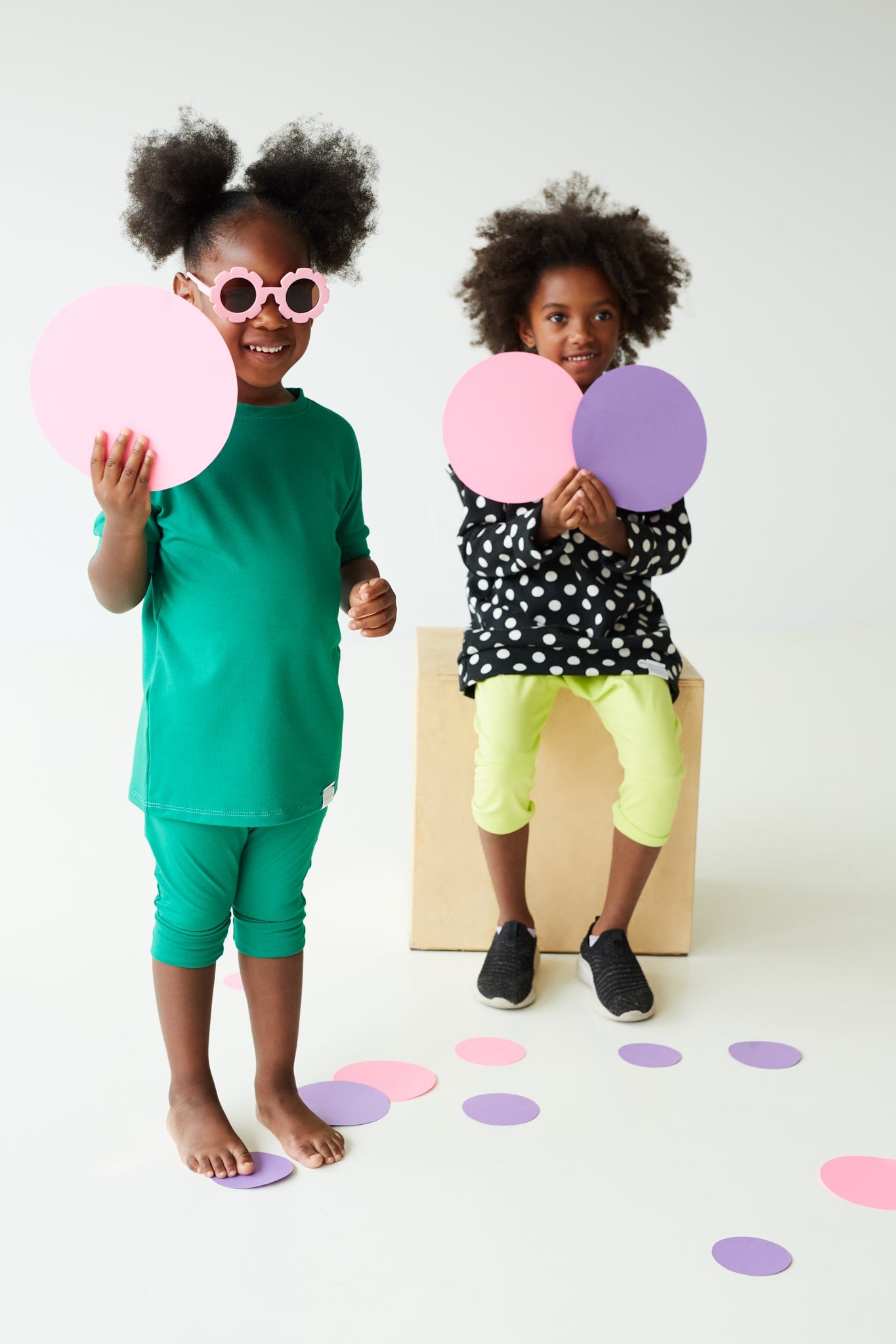 Green grow-with-me t-shirt for kids, made from soft organic cotton with a stretchy, foldable waistband. Ethically made in Canada for a sustainable and comfy fit.