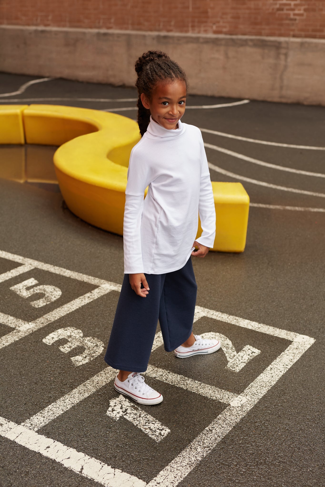 Eco-friendly kids' clothing – gender-neutral navy wide leg pants grow-with-me pants, sustainably made in Canada.