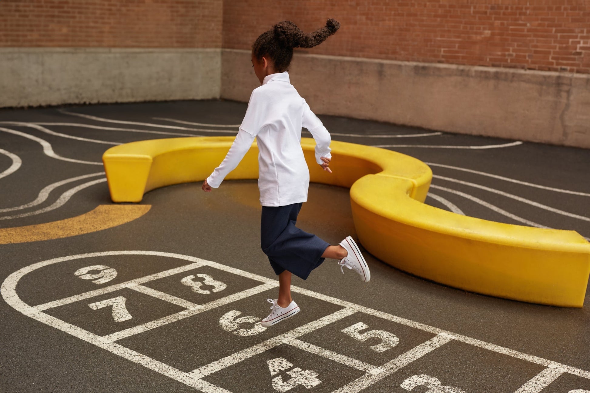 Eco-friendly kids' clothing – gender-neutral navy wide leg pants grow-with-me pants, sustainably made in Canada.