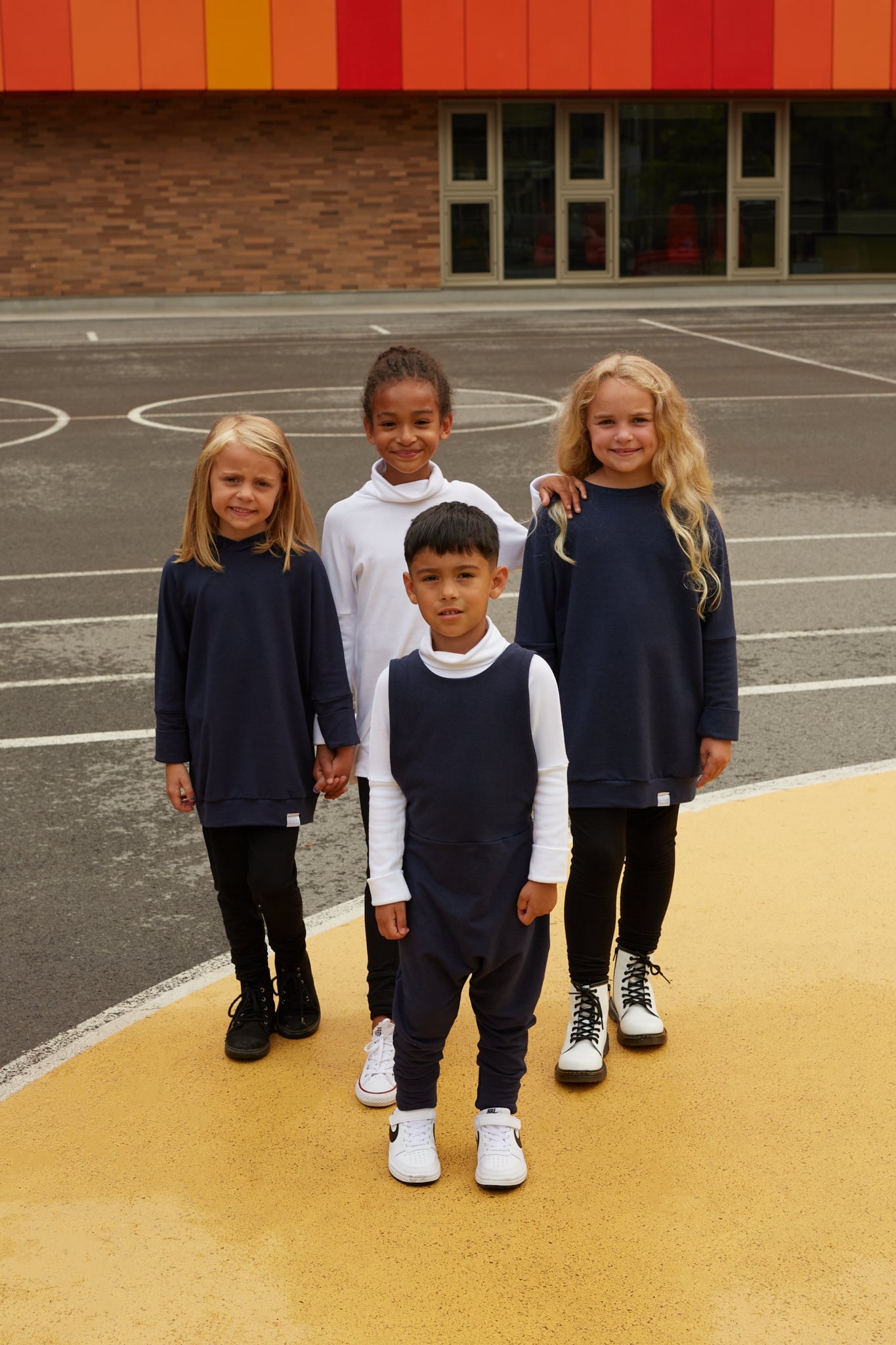 Eco-friendly kids' clothing – gender-neutral Navy grow with me sweater, sustainably made in Canada.