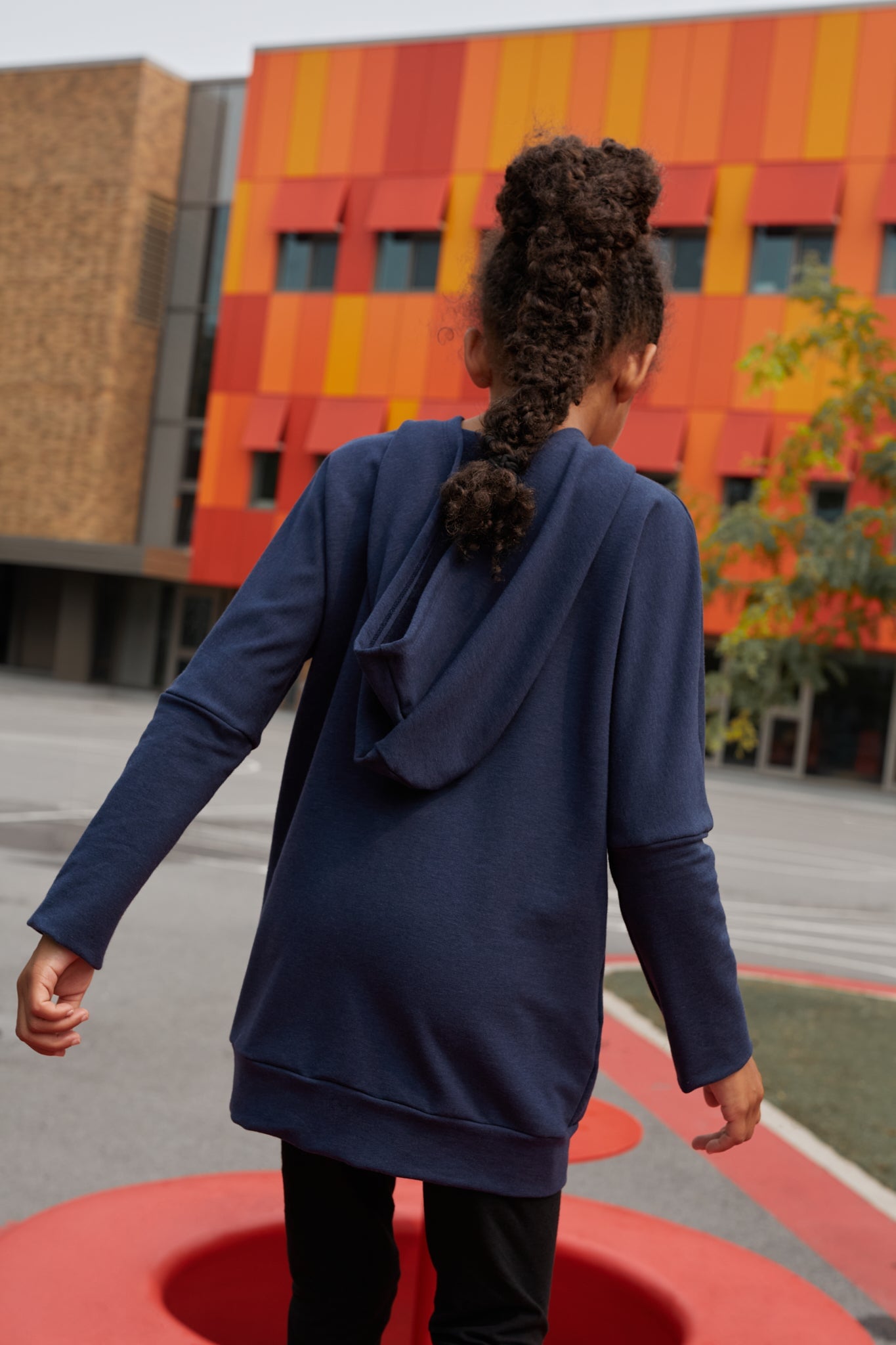 Eco-friendly kids' clothing – gender-neutral navy grow with me hoodie, sustainably made in Canada.