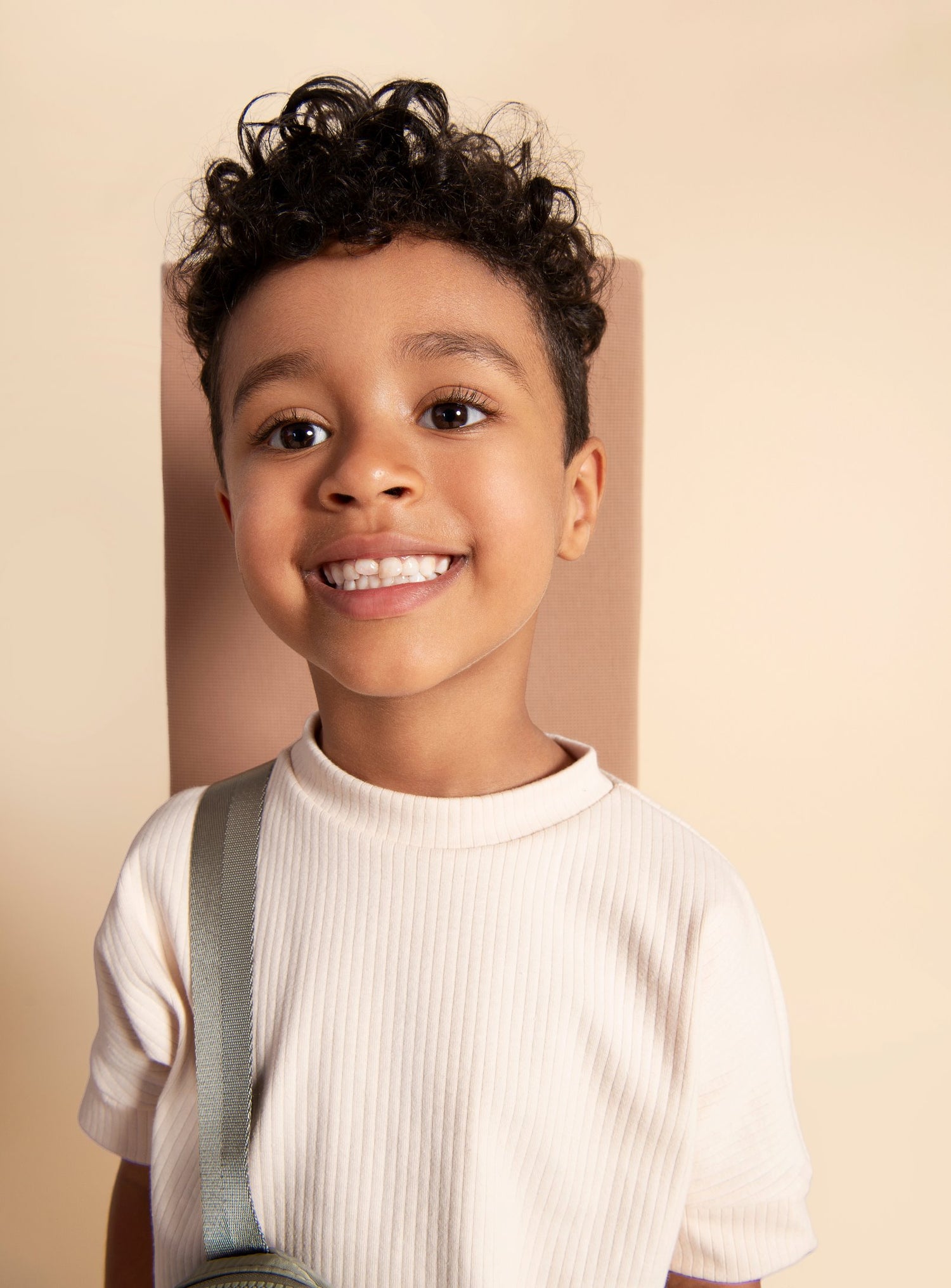 Oat Milk grow-with-me t-shirt for kids, made from soft organic cotton with a stretchy, foldable waistband. Ethically made in Canada for a sustainable and comfy fit.