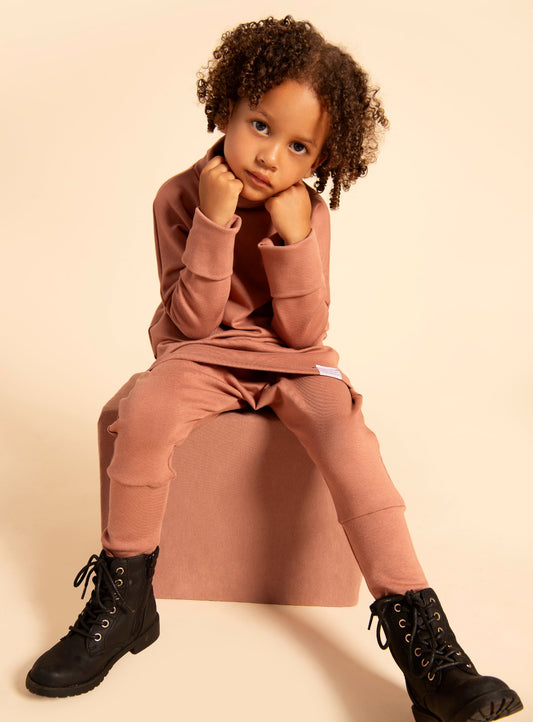 Eco-friendly kids' clothing – gender-neutral Dark Pink grow with me turtleneck, sustainably made in Canada.