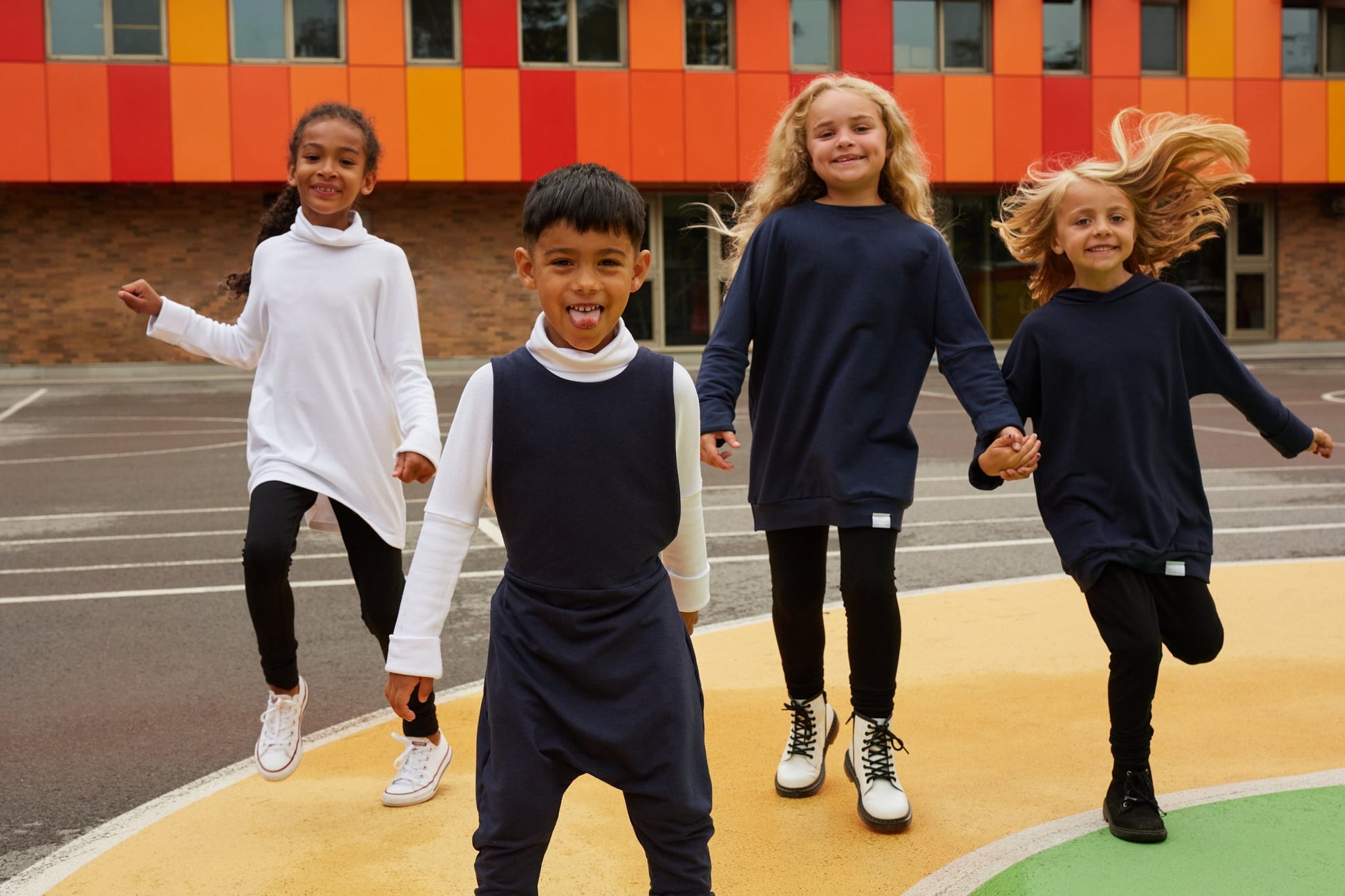 navy grow-with-me overalls for toddlers and kids, made from soft, eco-friendly fabric. Adjustable straps and cuffs for a long-lasting fit. Ethically made in Canada.