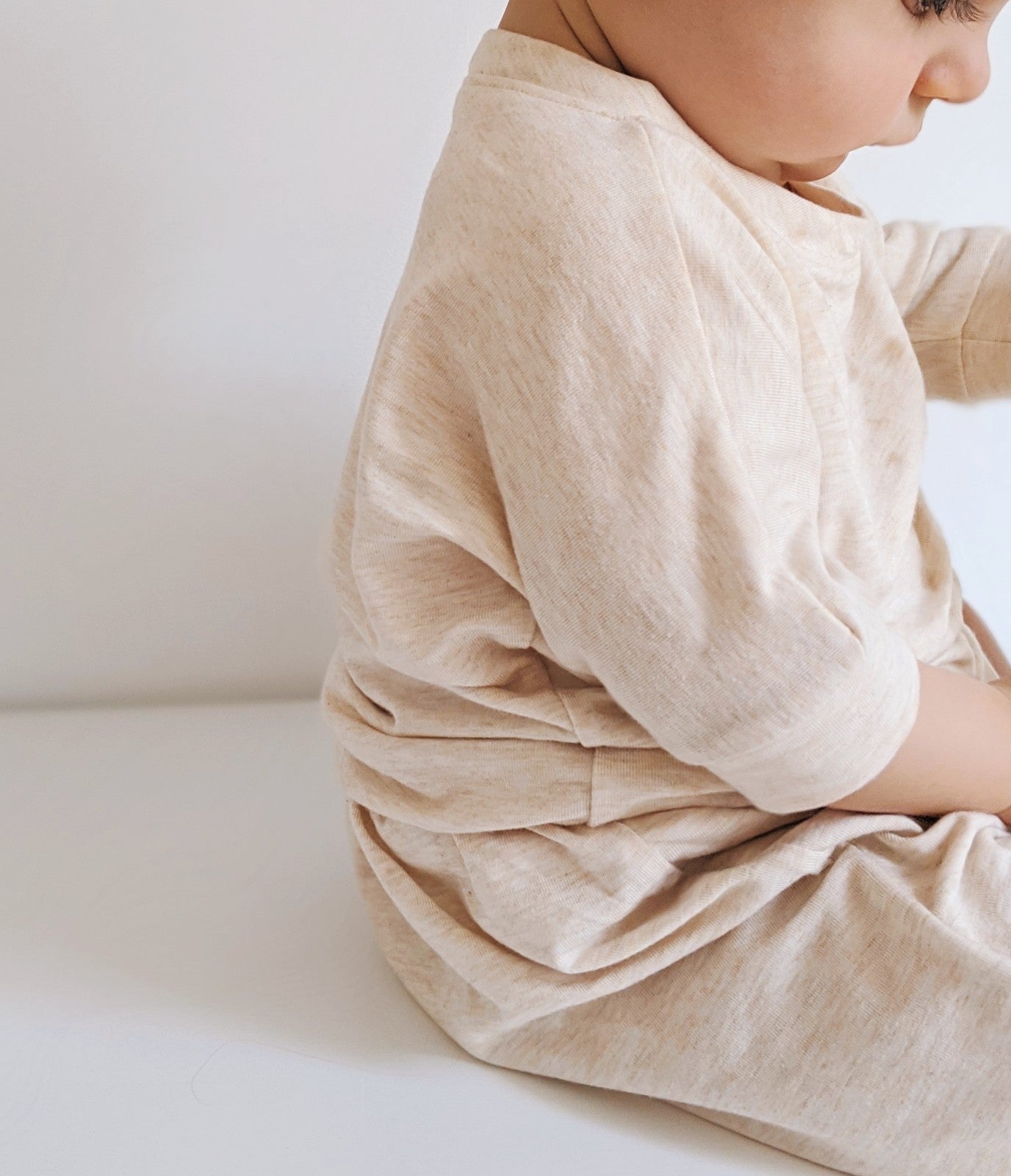 Heather Cream grow-with-me t-shirt for kids, made from soft Lyocell. Ethically made in Canada for a sustainable and comfy fit.