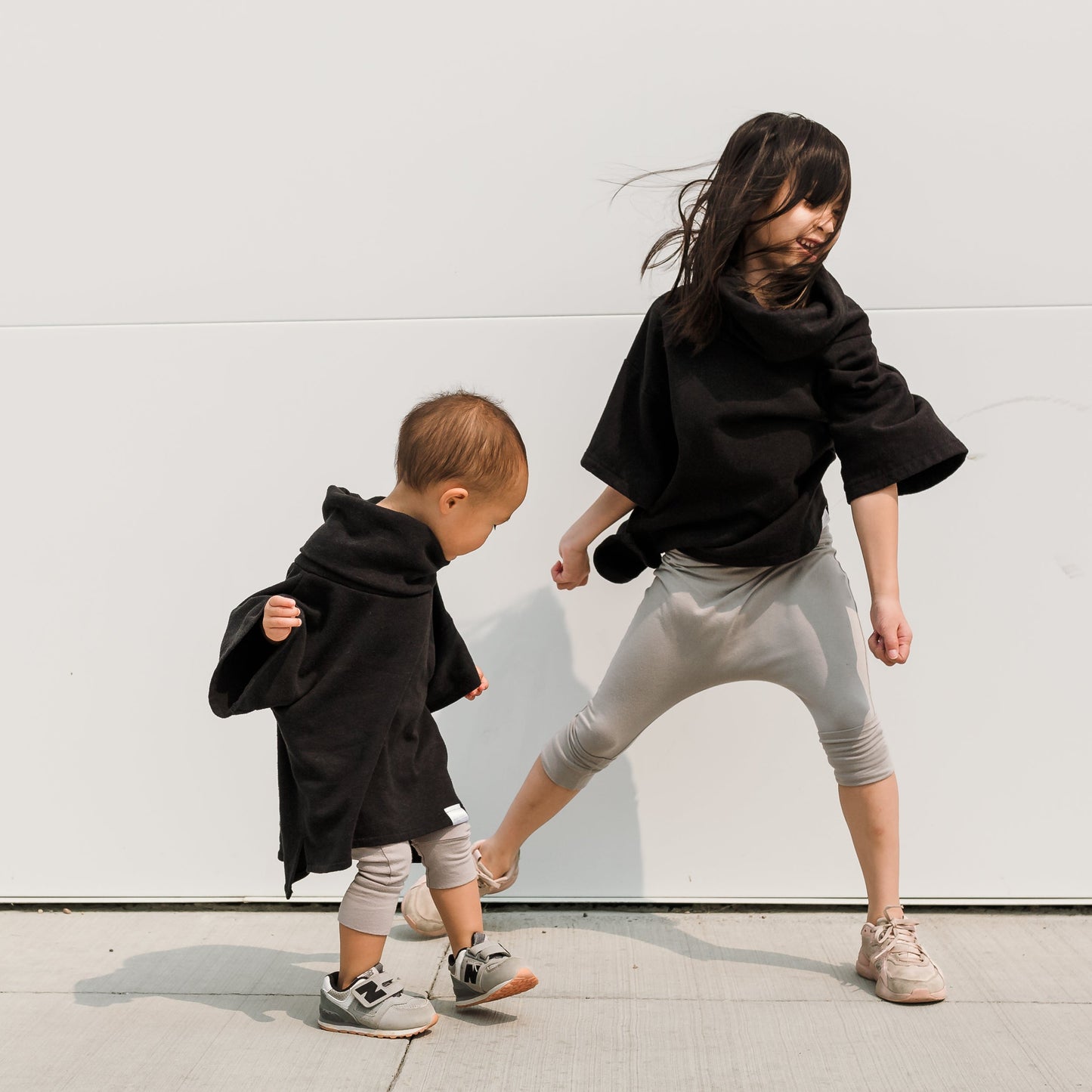 Taupe grow-with-me shorts for kids, made from soft organic cotton with a stretchy, foldable waistband. Ethically made in Canada for a sustainable and comfy fit.