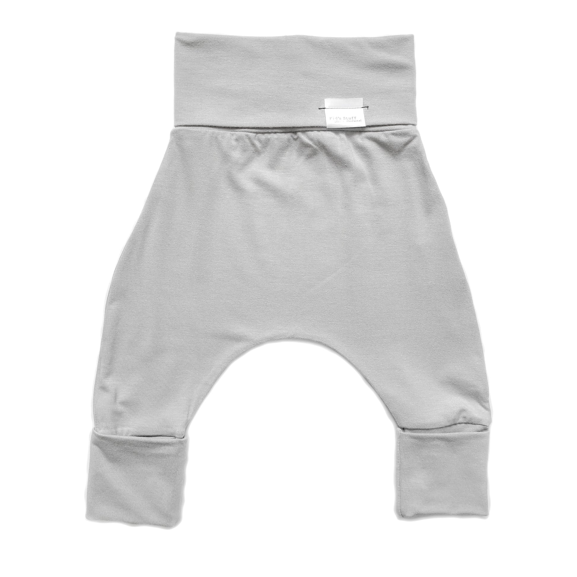 Taupe grow-with-me pants for toddlers and kids, made from soft, eco-friendly fabric. Adjustable waistband and cuffs for extended wear. Ethically made in Canada.
