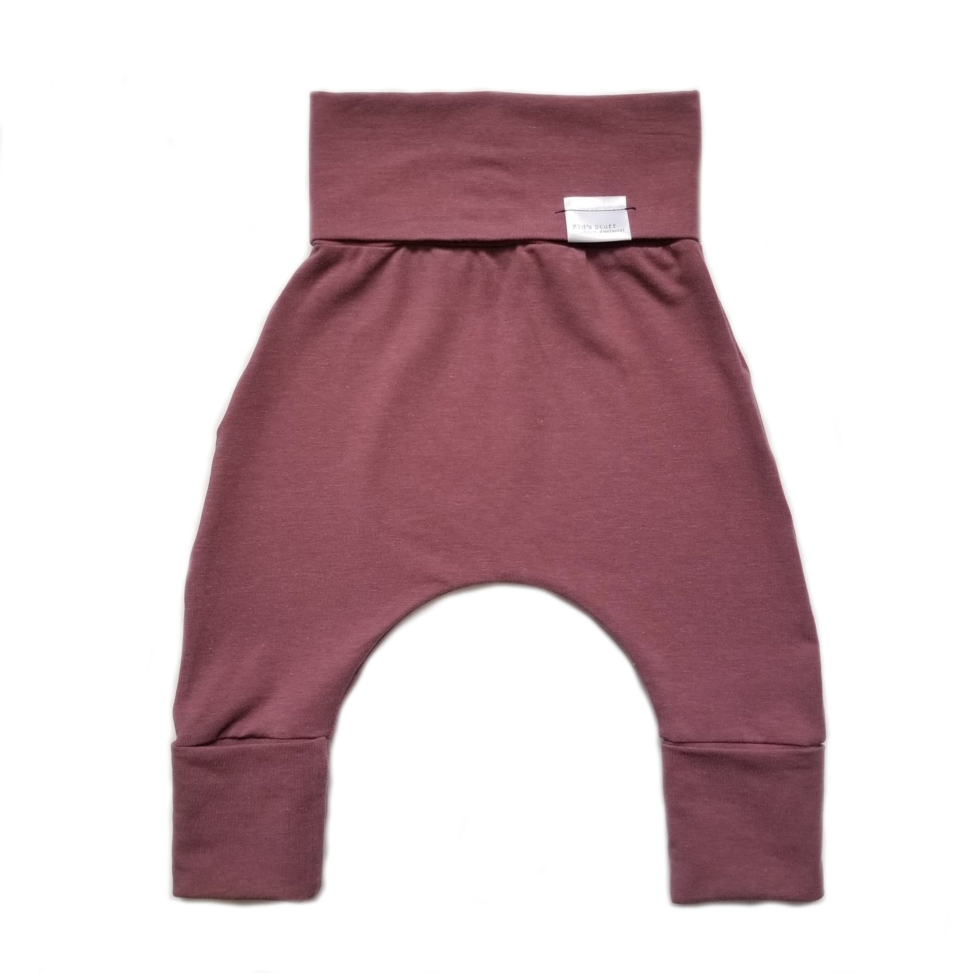 Rose brown grow-with-me pants for toddlers and kids, made from soft, eco-friendly fabric. Adjustable waistband and cuffs for extended wear. Ethically made in Canada.
