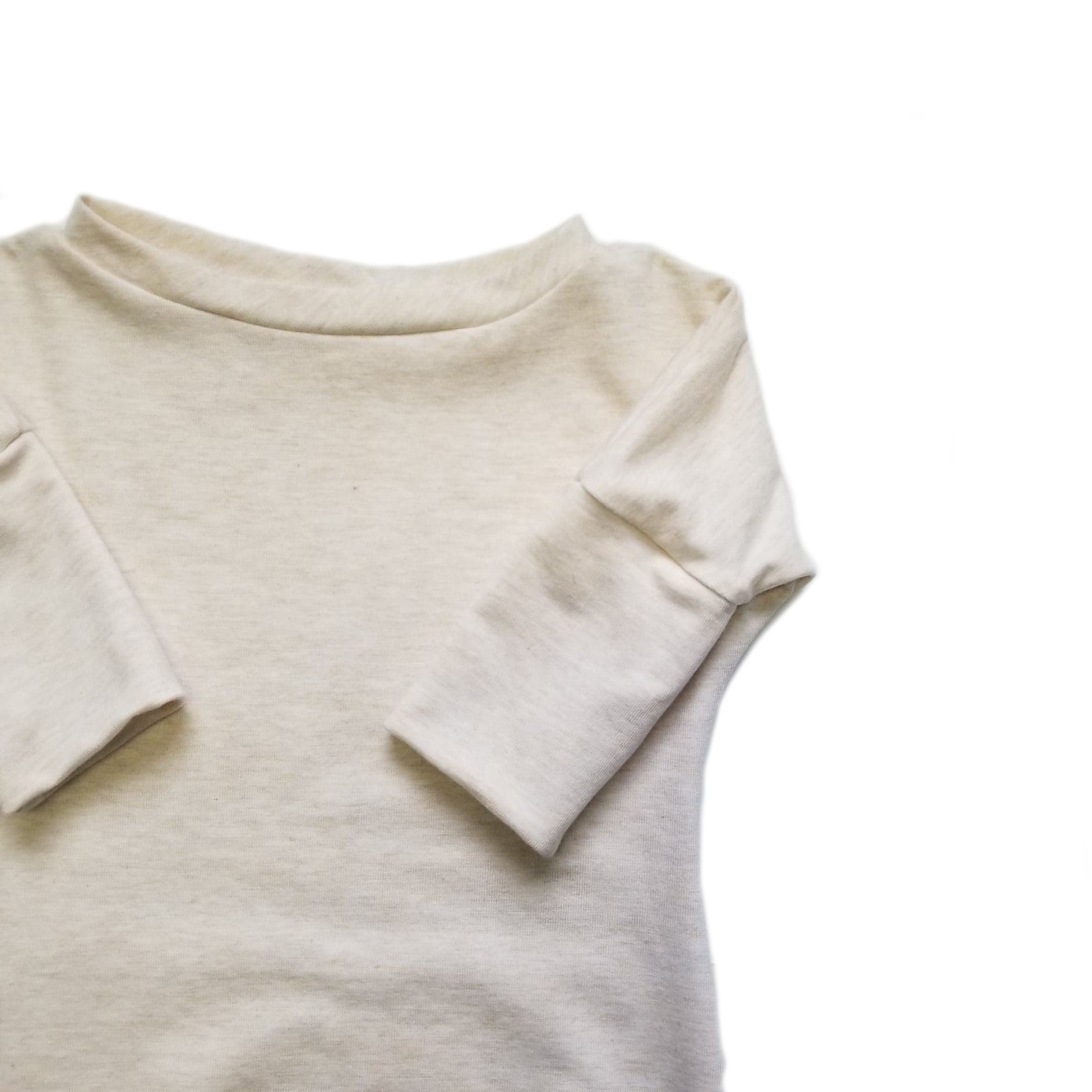 Eco-friendly kids' clothing – gender-neutral heather cream newborn gown, sustainably made in Canada.