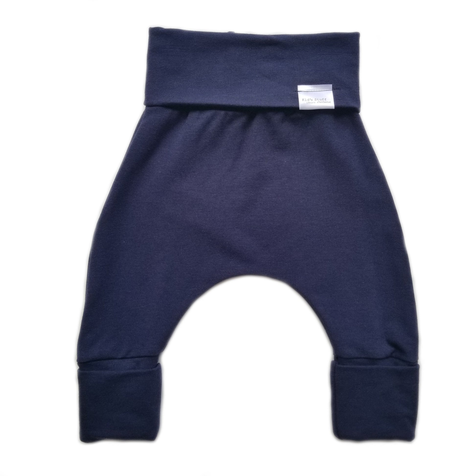 Navy grow-with-me pants for toddlers and kids, made from soft, eco-friendly fabric. Adjustable waistband and cuffs for extended wear. Ethically made in Canada.