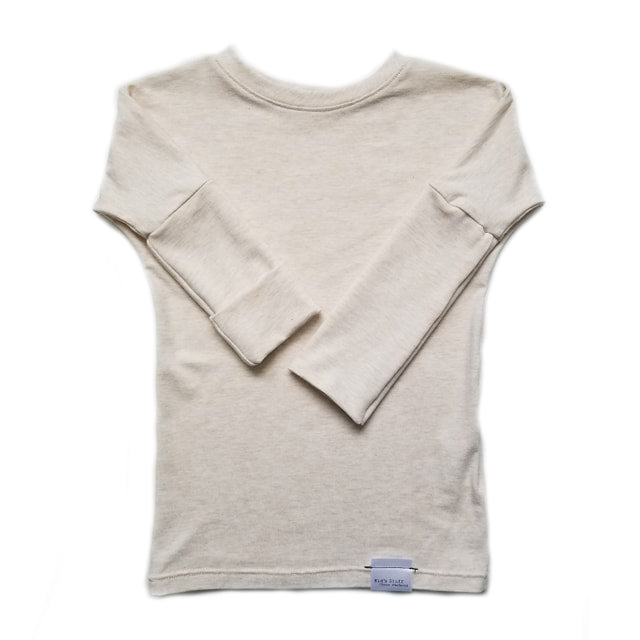 Heather Cream grow-with-me shirt for toddlers and kids, designed to be worn as a dress, tunic, or long shirt. Seamless shoulders and soft, eco-friendly fabric. Ethically made in Canada.