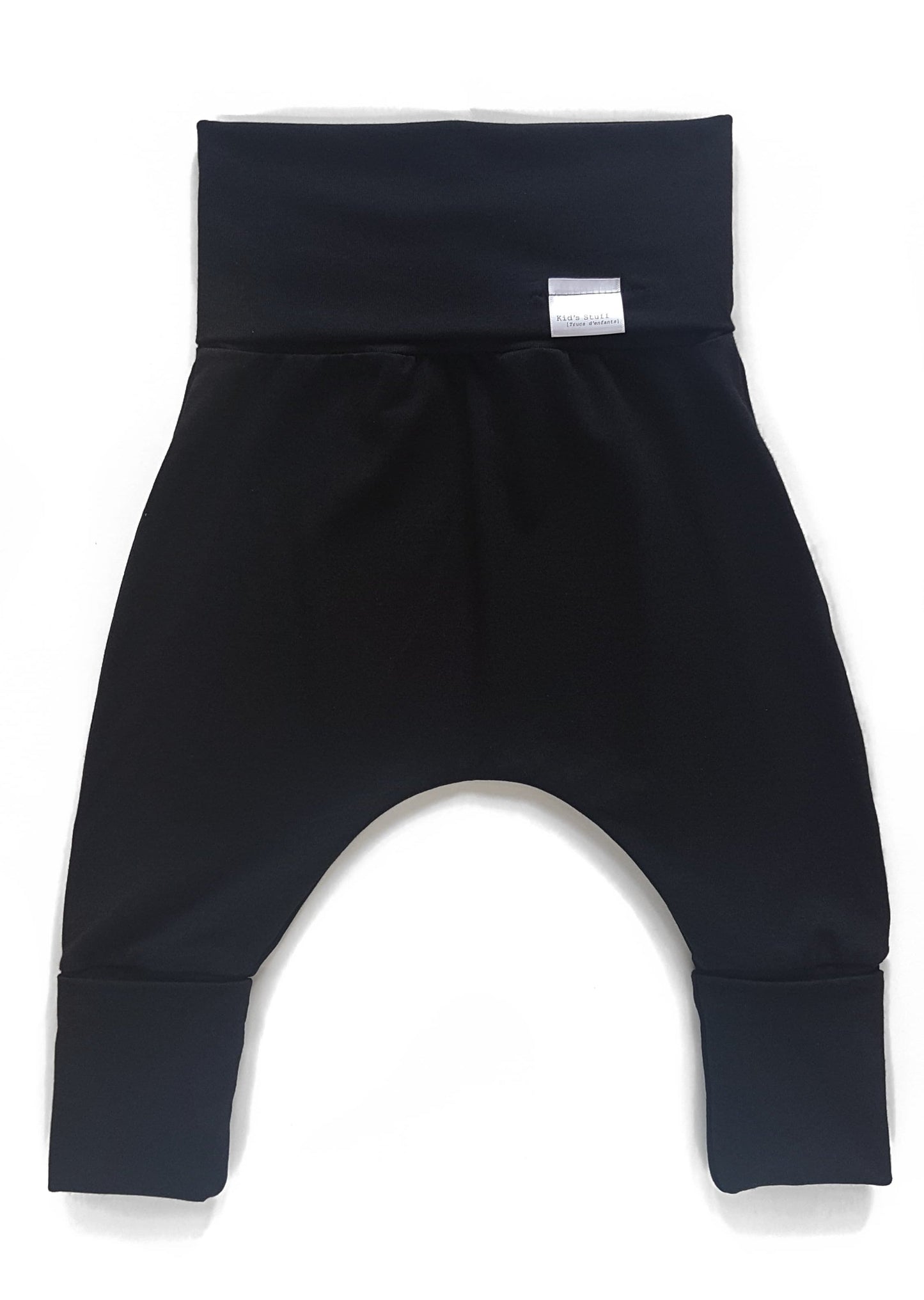 Black grow-with-me pants for toddlers and kids, made from soft, eco-friendly fabric. Adjustable waistband and cuffs for extended wear. Ethically made in Canada.