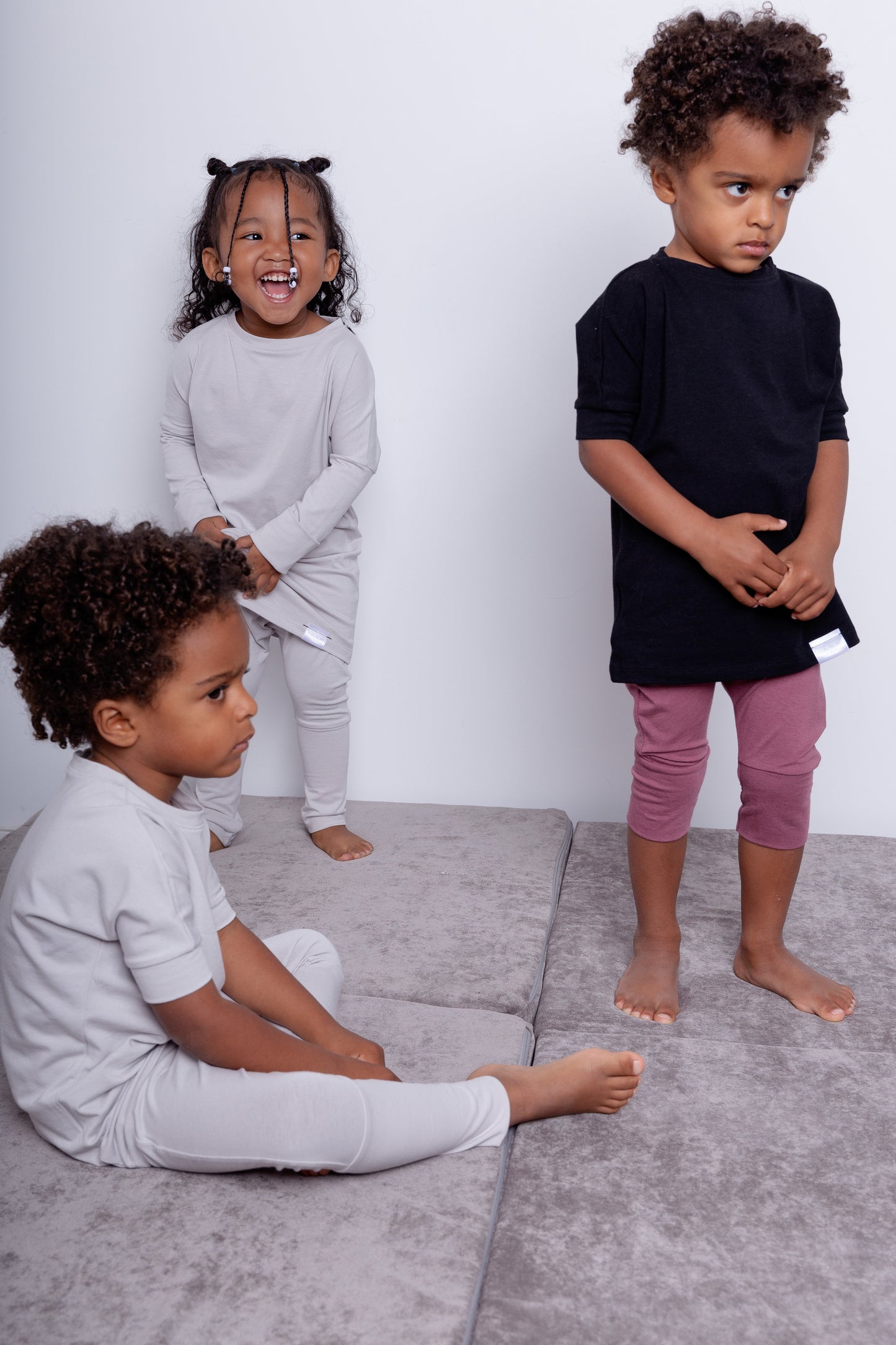 Black grow-with-me t-shirt for kids, made from soft Lyocell. Ethically made in Canada for a sustainable and comfy fit.