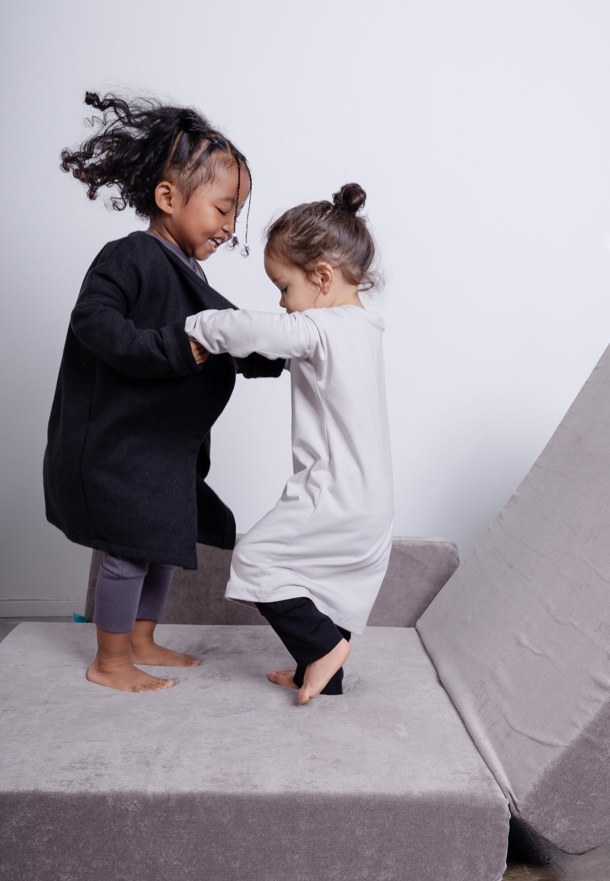 Taupe grow-with-me shirt for toddlers and kids, designed to be worn as a dress, tunic, or long shirt. Seamless shoulders and soft, eco-friendly fabric. Ethically made in Canada.