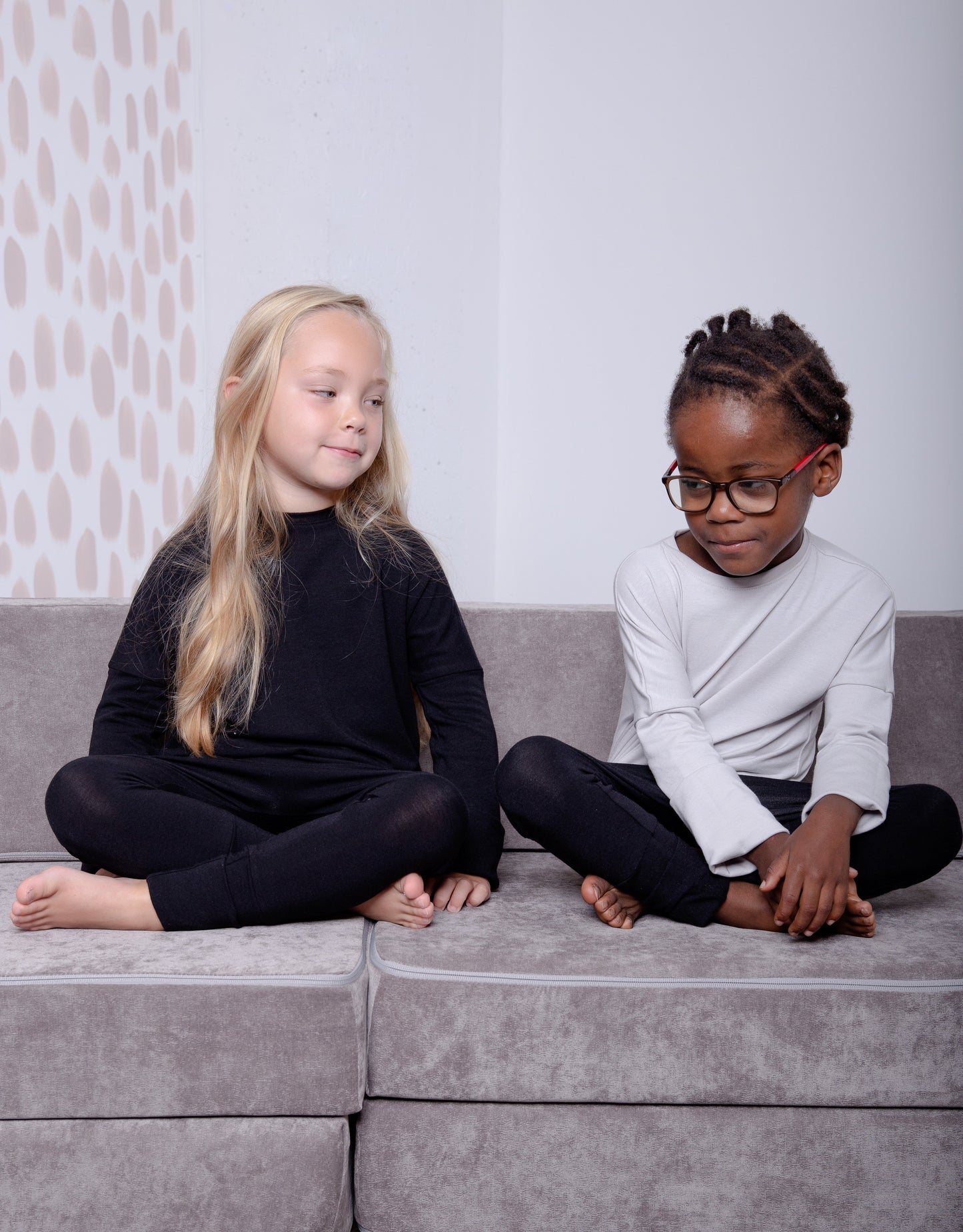 Black grow-with-me pants for toddlers and kids, made from soft, eco-friendly fabric. Adjustable waistband and cuffs for extended wear. Ethically made in Canada.