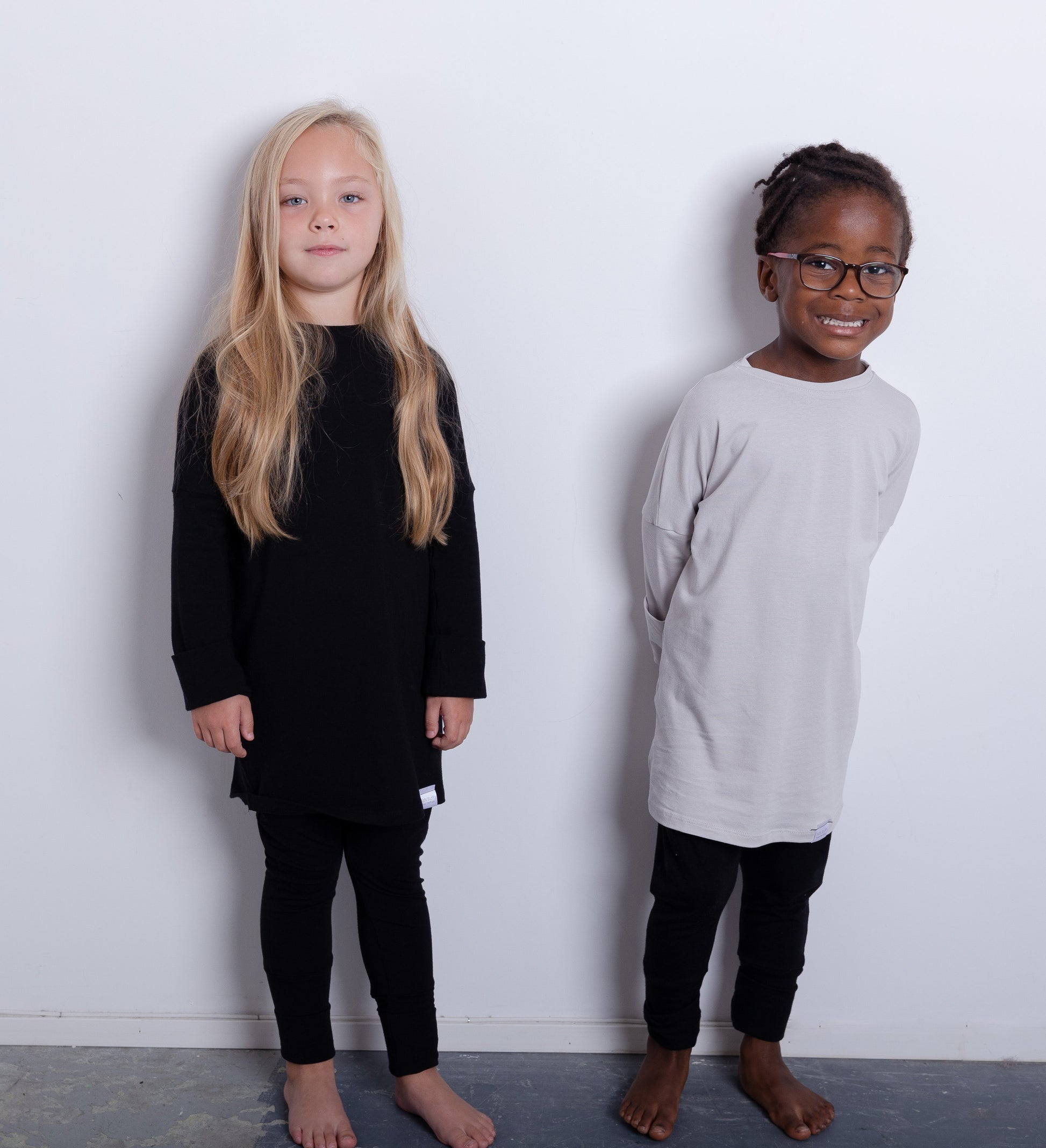 Taupe grow-with-me shirt for toddlers and kids, designed to be worn as a dress, tunic, or long shirt. Seamless shoulders and soft, eco-friendly fabric. Ethically made in Canada.