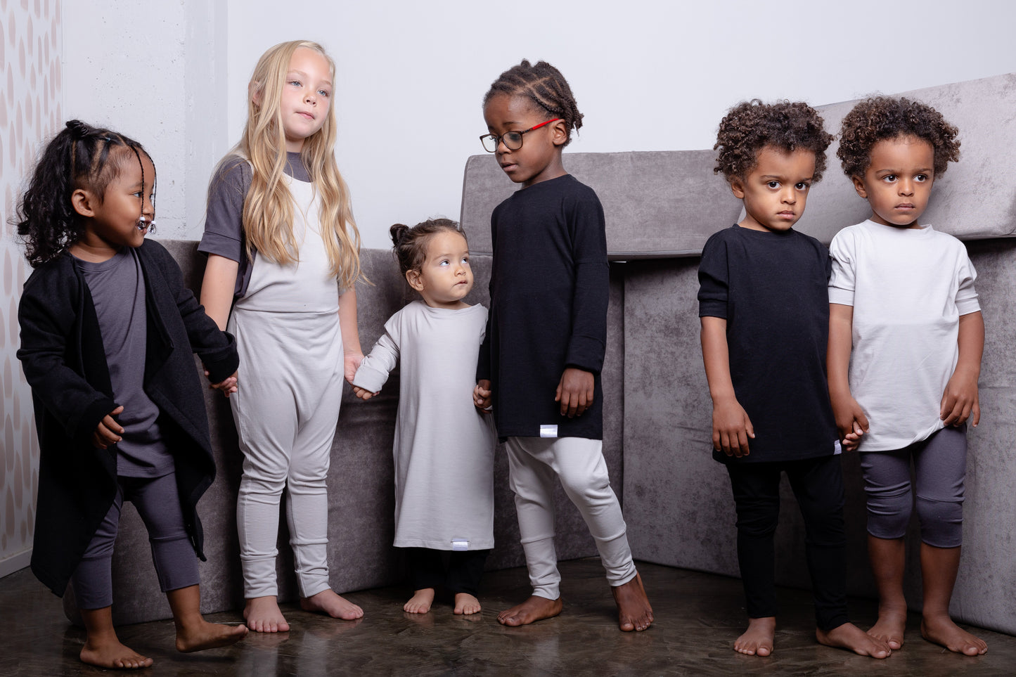 Black grow-with-me t-shirt for kids, made from soft Lyocell. Ethically made in Canada for a sustainable and comfy fit.