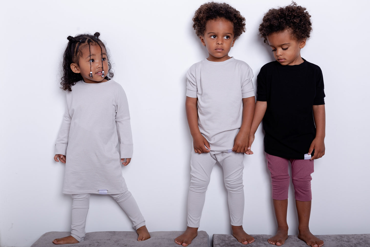 Black grow-with-me t-shirt for kids, made from soft Lyocell. Ethically made in Canada for a sustainable and comfy fit.