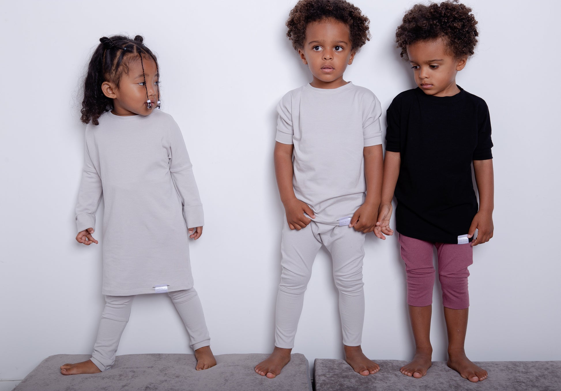 Taupe grow-with-me shirt for toddlers and kids, designed to be worn as a dress, tunic, or long shirt. Seamless shoulders and soft, eco-friendly fabric. Ethically made in Canada.
