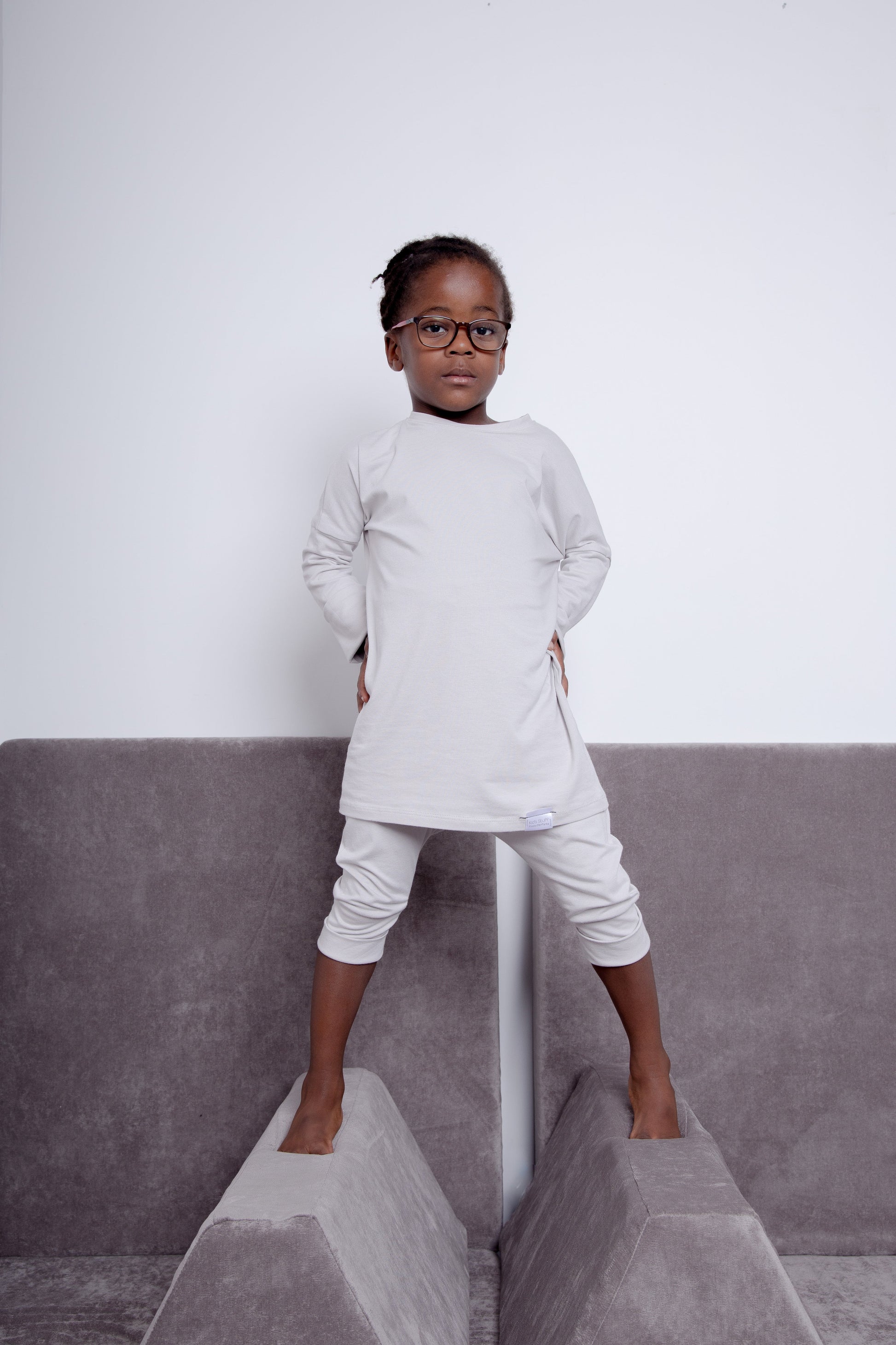 Taupe grow-with-me shirt for toddlers and kids, designed to be worn as a dress, tunic, or long shirt. Seamless shoulders and soft, eco-friendly fabric. Ethically made in Canada.
