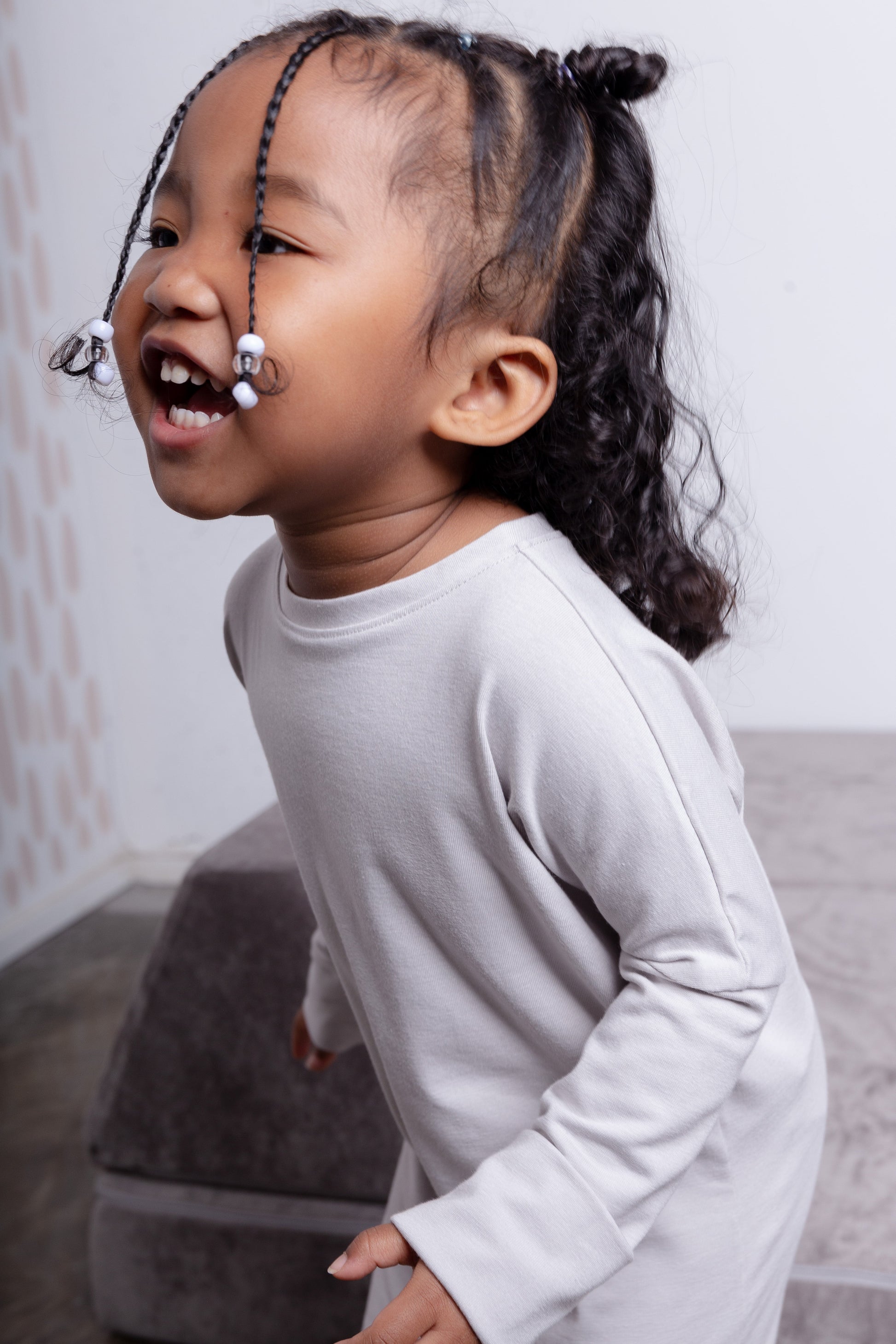 Taupe grow-with-me shirt for toddlers and kids, designed to be worn as a dress, tunic, or long shirt. Seamless shoulders and soft, eco-friendly fabric. Ethically made in Canada.