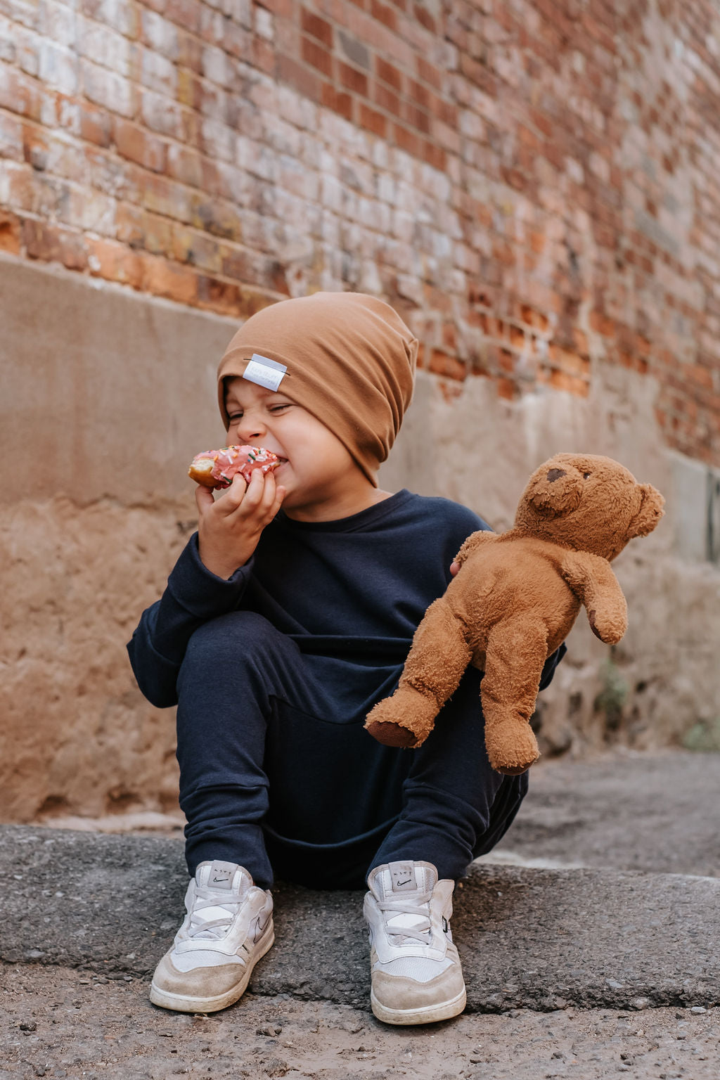 Navy grow-with-me pants for toddlers and kids, made from soft, eco-friendly fabric. Adjustable waistband and cuffs for extended wear. Ethically made in Canada.