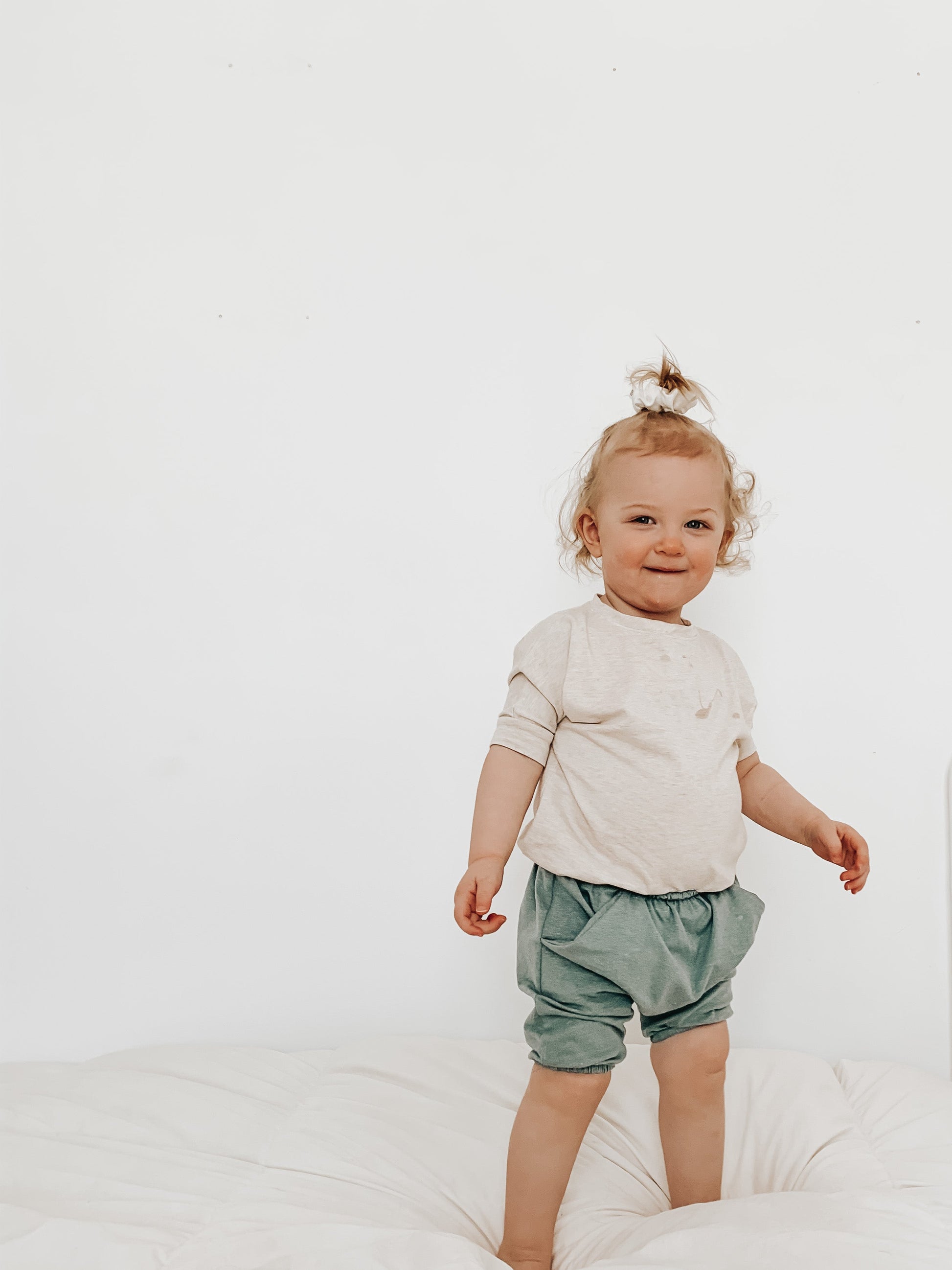 Heather Cream grow-with-me t-shirt for kids, made from soft Lyocell. Ethically made in Canada for a sustainable and comfy fit.