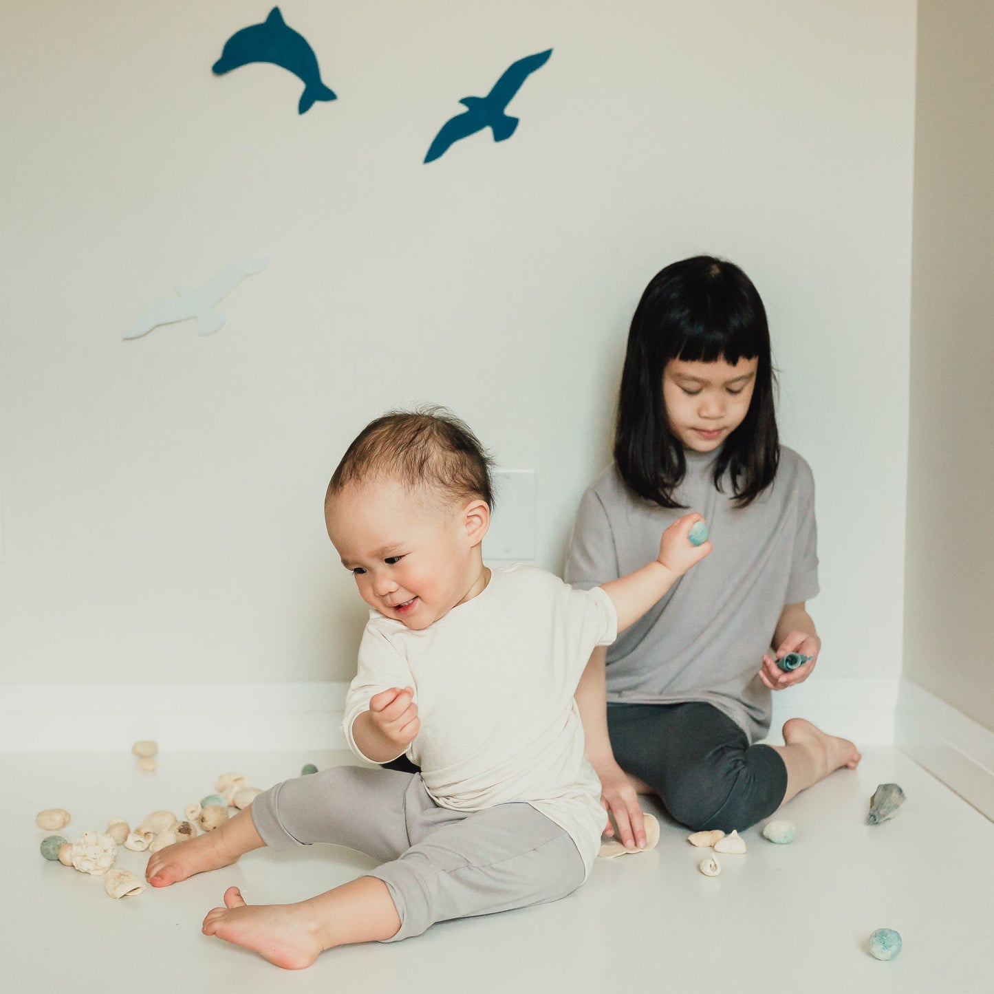 Taupe grow-with-me shorts for kids, made from soft organic cotton with a stretchy, foldable waistband. Ethically made in Canada for a sustainable and comfy fit.