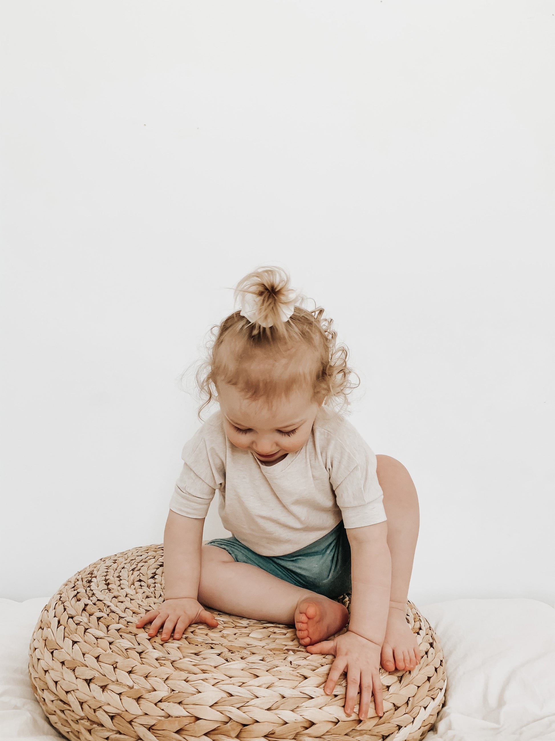 Heather Cream grow-with-me t-shirt for kids, made from soft Lyocell. Ethically made in Canada for a sustainable and comfy fit.