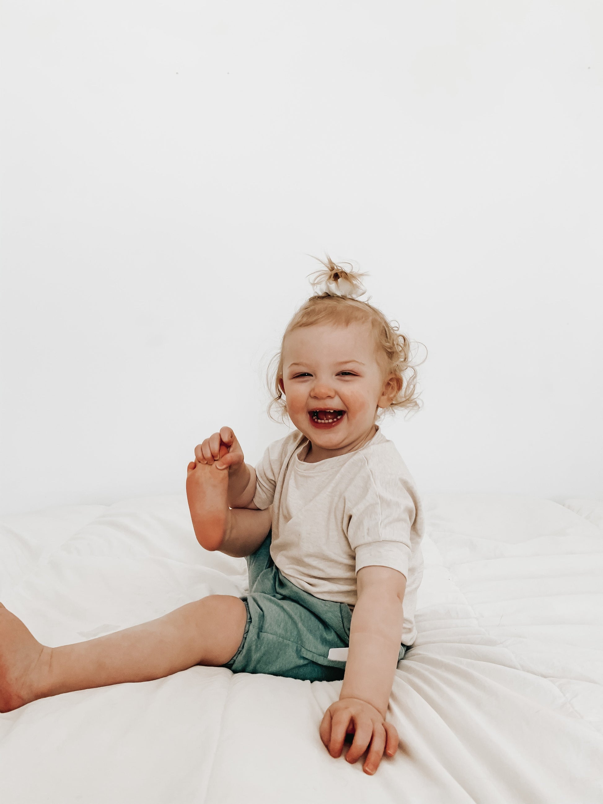 Heather Cream grow-with-me t-shirt for kids, made from soft Lyocell. Ethically made in Canada for a sustainable and comfy fit.