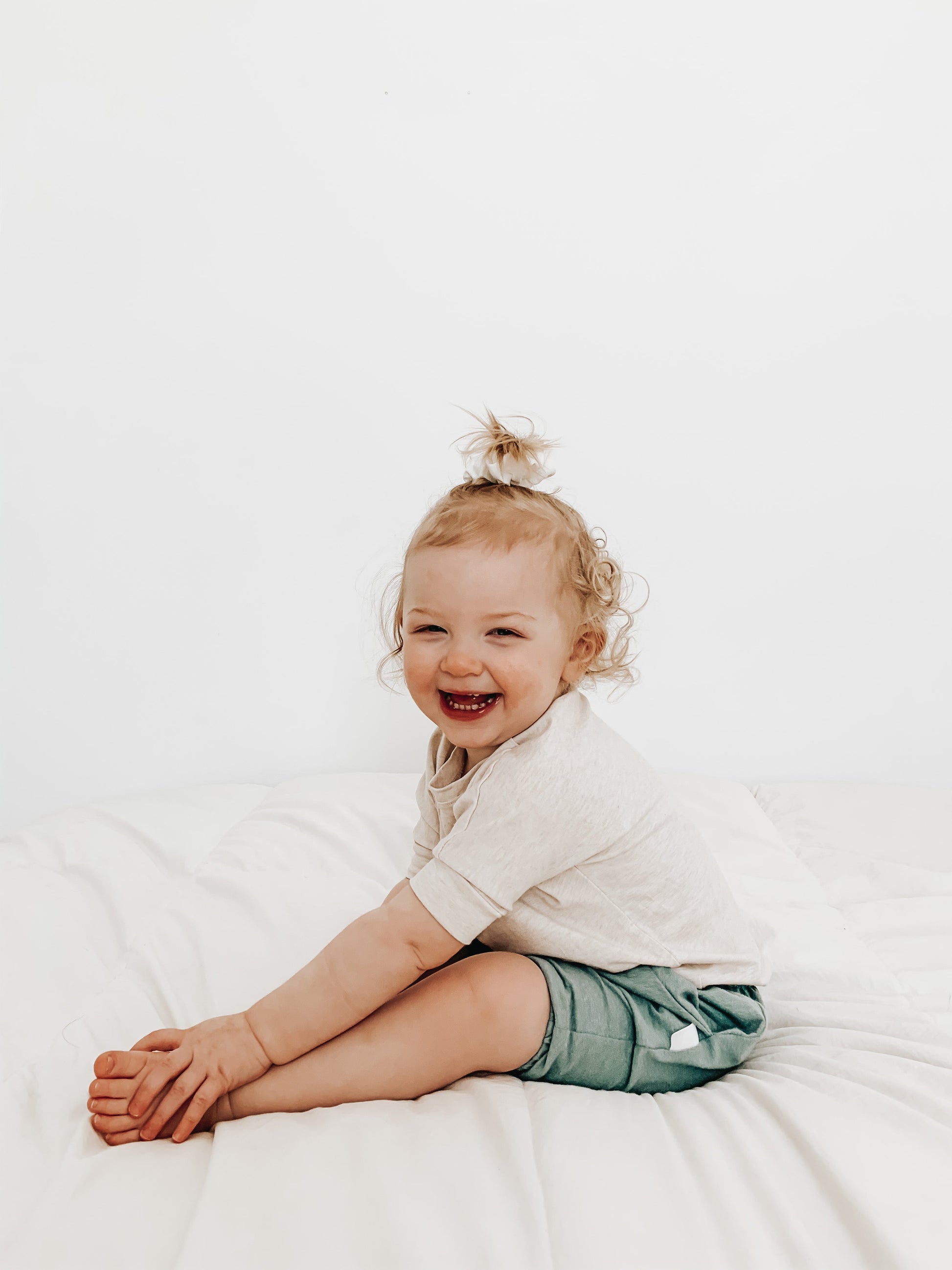 Heather Cream grow-with-me t-shirt for kids, made from soft Lyocell. Ethically made in Canada for a sustainable and comfy fit.