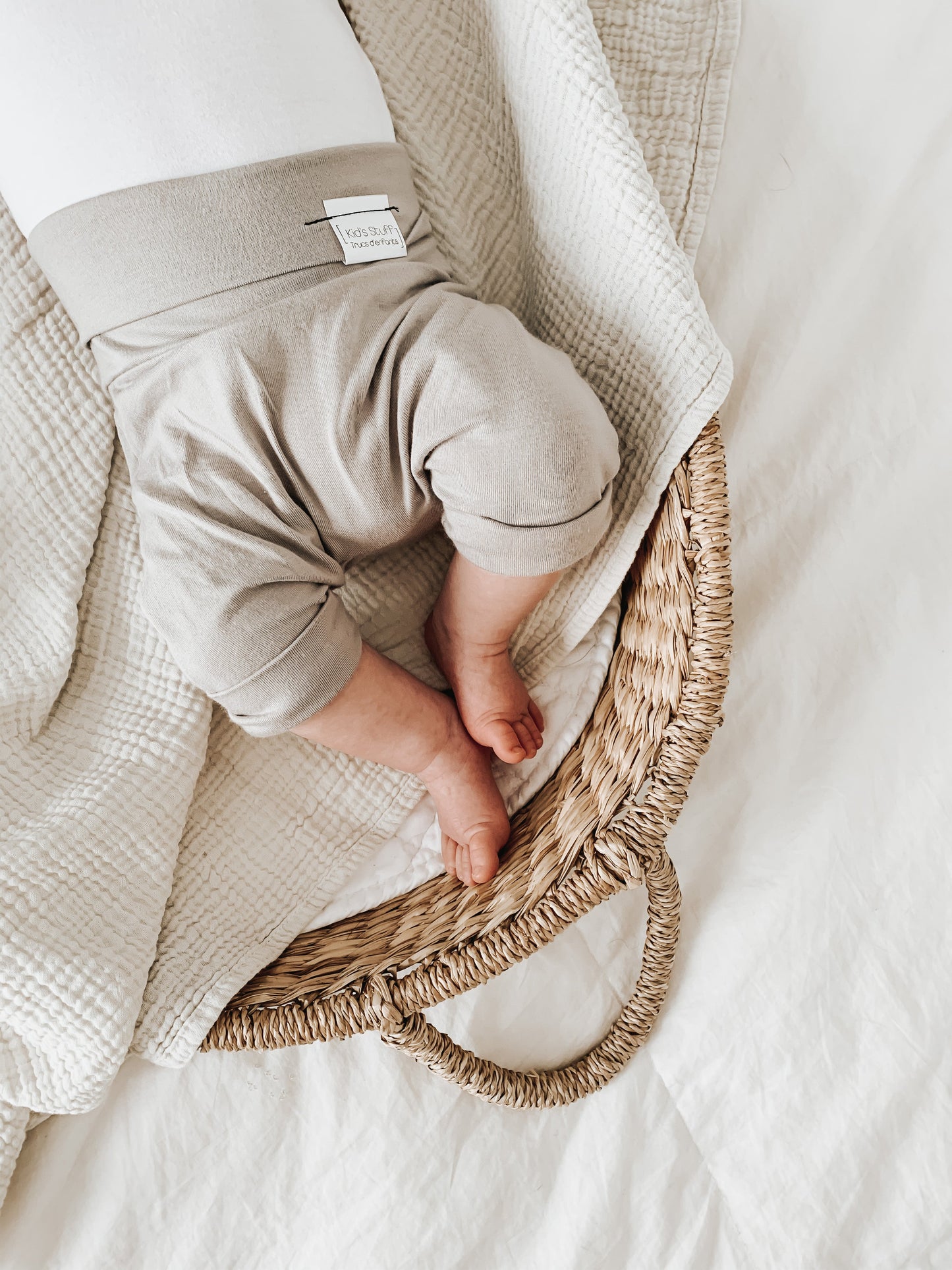 Taupe grow-with-me shorts for kids, made from soft organic cotton with a stretchy, foldable waistband. Ethically made in Canada for a sustainable and comfy fit.