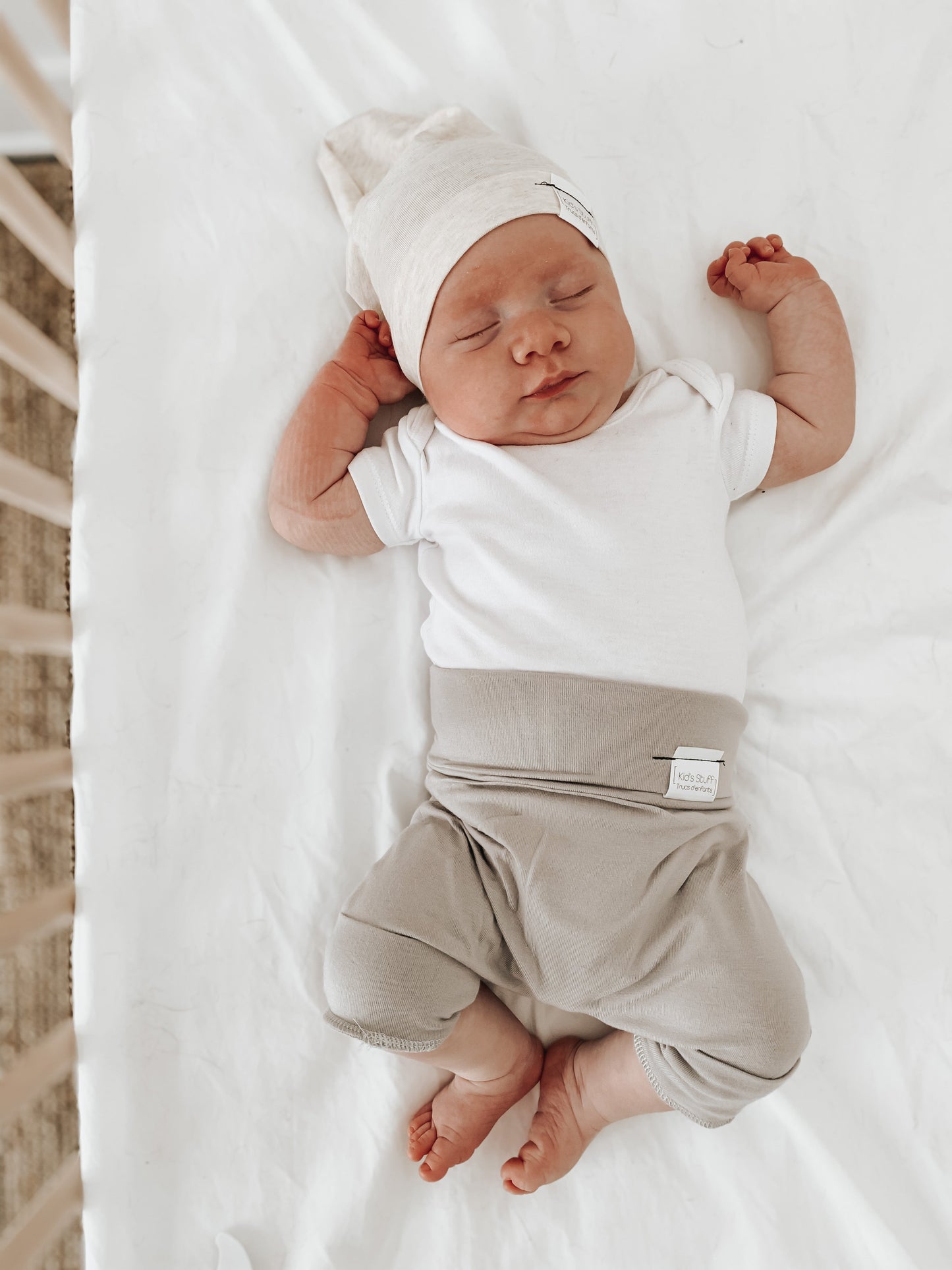 Taupe grow-with-me shorts for kids, made from soft organic cotton with a stretchy, foldable waistband. Ethically made in Canada for a sustainable and comfy fit.
