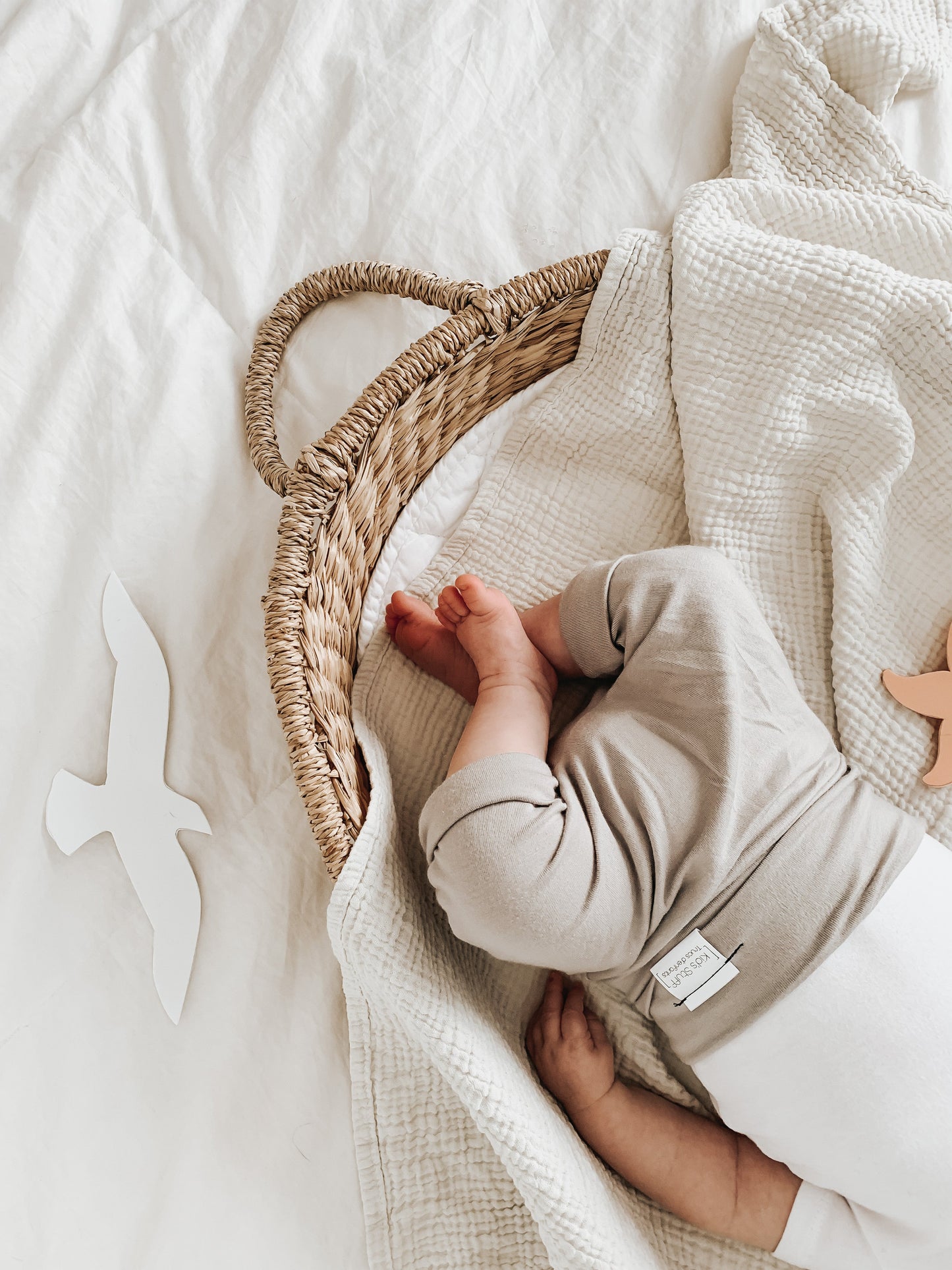 Taupe grow-with-me shorts for kids, made from soft organic cotton with a stretchy, foldable waistband. Ethically made in Canada for a sustainable and comfy fit.