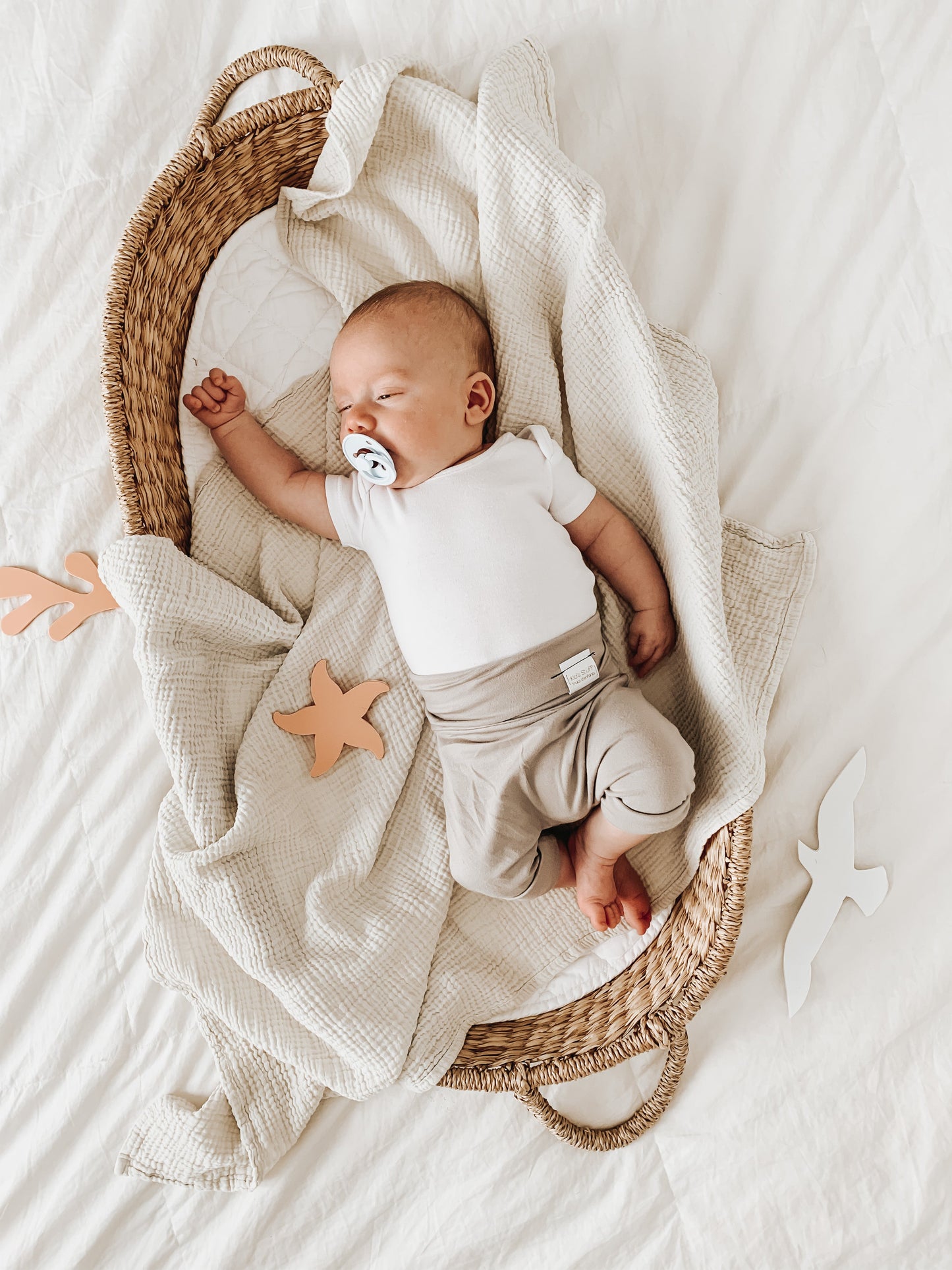 Taupe grow-with-me shorts for kids, made from soft organic cotton with a stretchy, foldable waistband. Ethically made in Canada for a sustainable and comfy fit.