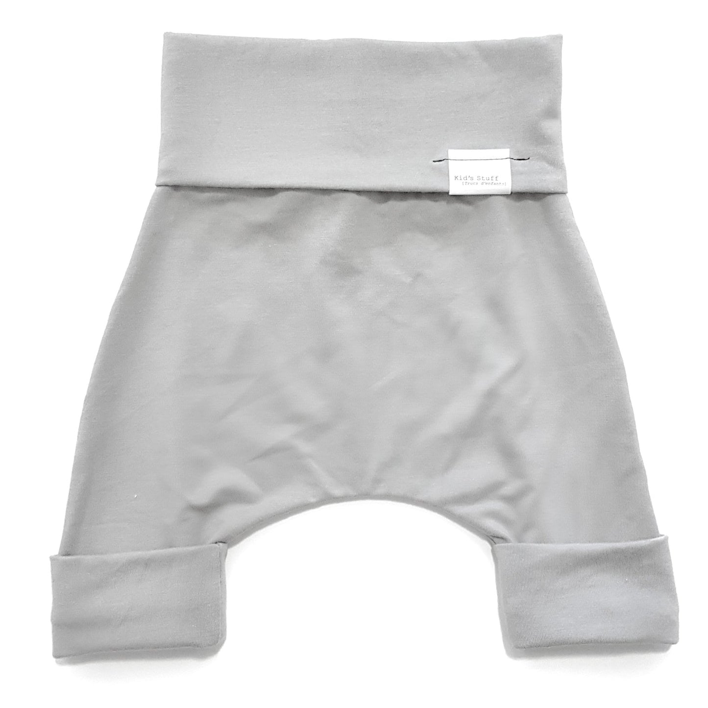 Taupe grow-with-me shorts for kids, made from soft organic cotton with a stretchy, foldable waistband. Ethically made in Canada for a sustainable and comfy fit.