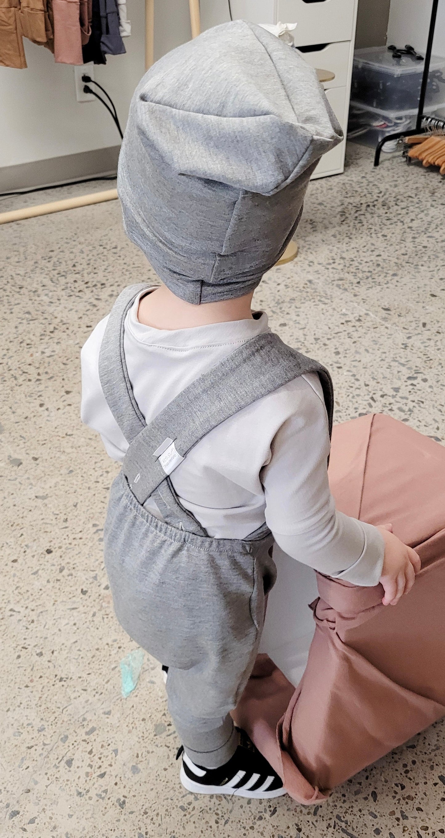 Soft and stretchy grey cloud beanie for kids, made from eco-friendly fabric. Ethically crafted in Canada, featuring a fold-over brim and minimalist design