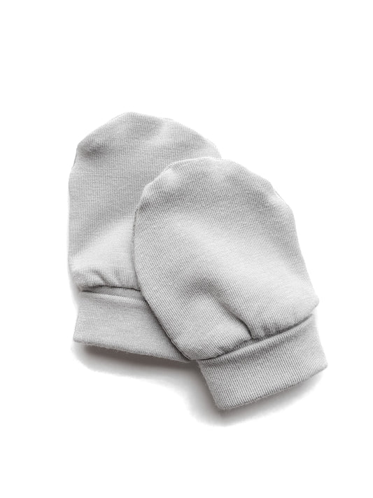 Soft and eco-friendly taupe newborn mittens, designed to protect delicate skin and prevent scratching. Ethically made in Canada for ultimate comfort and warmth