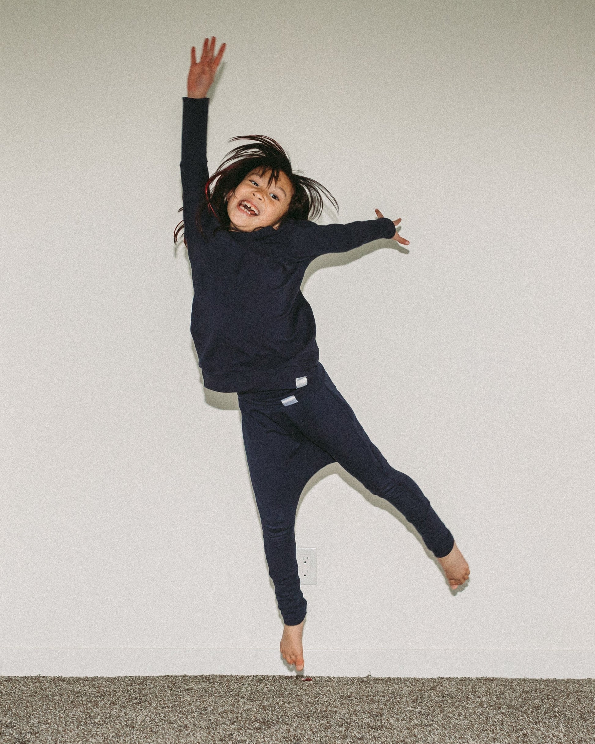 Eco-friendly kids' clothing – gender-neutral Navy grow with me sweater, sustainably made in Canada.