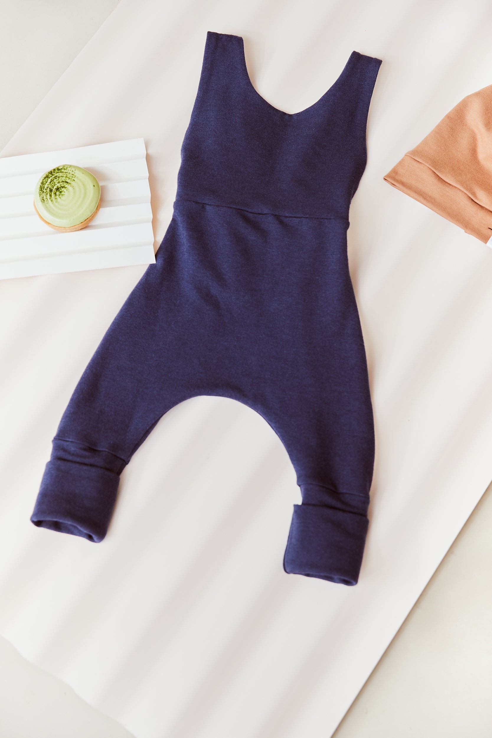 navy grow-with-me overalls for toddlers and kids, made from soft, eco-friendly fabric. Adjustable straps and cuffs for a long-lasting fit. Ethically made in Canada.