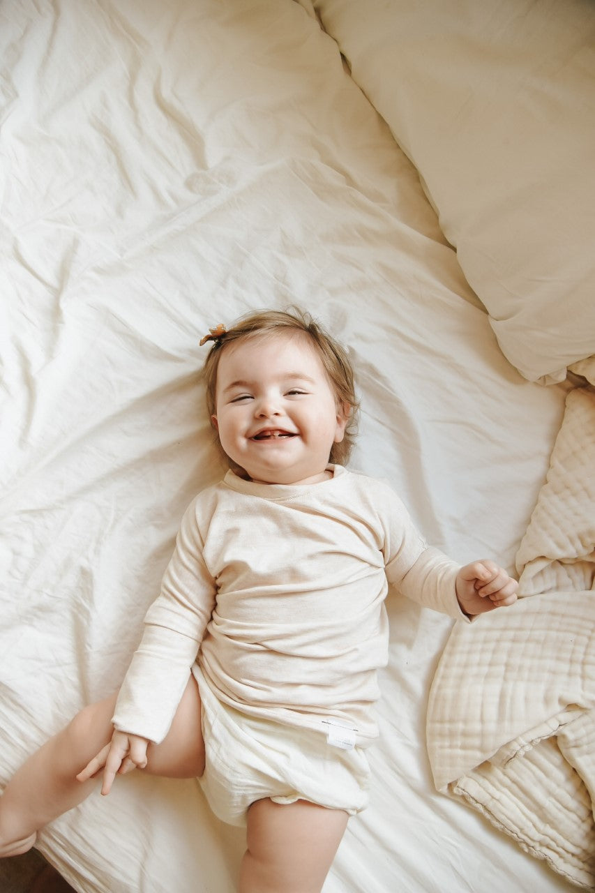 Heather Cream grow-with-me shirt for toddlers and kids, designed to be worn as a dress, tunic, or long shirt. Seamless shoulders and soft, eco-friendly fabric. Ethically made in Canada.