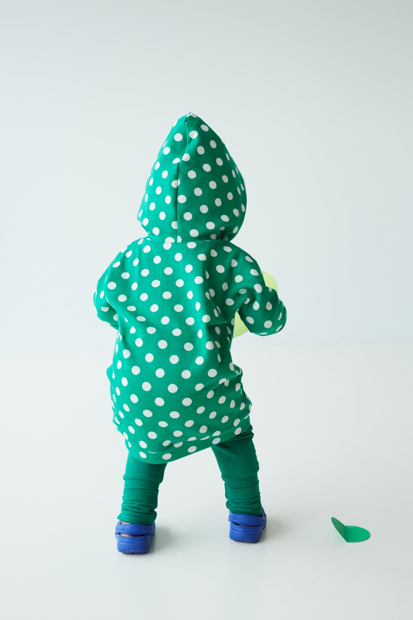 Eco-friendly kids' clothing – gender-neutral Green Polka Dots grow with me hoodie, sustainably made in Canada.
