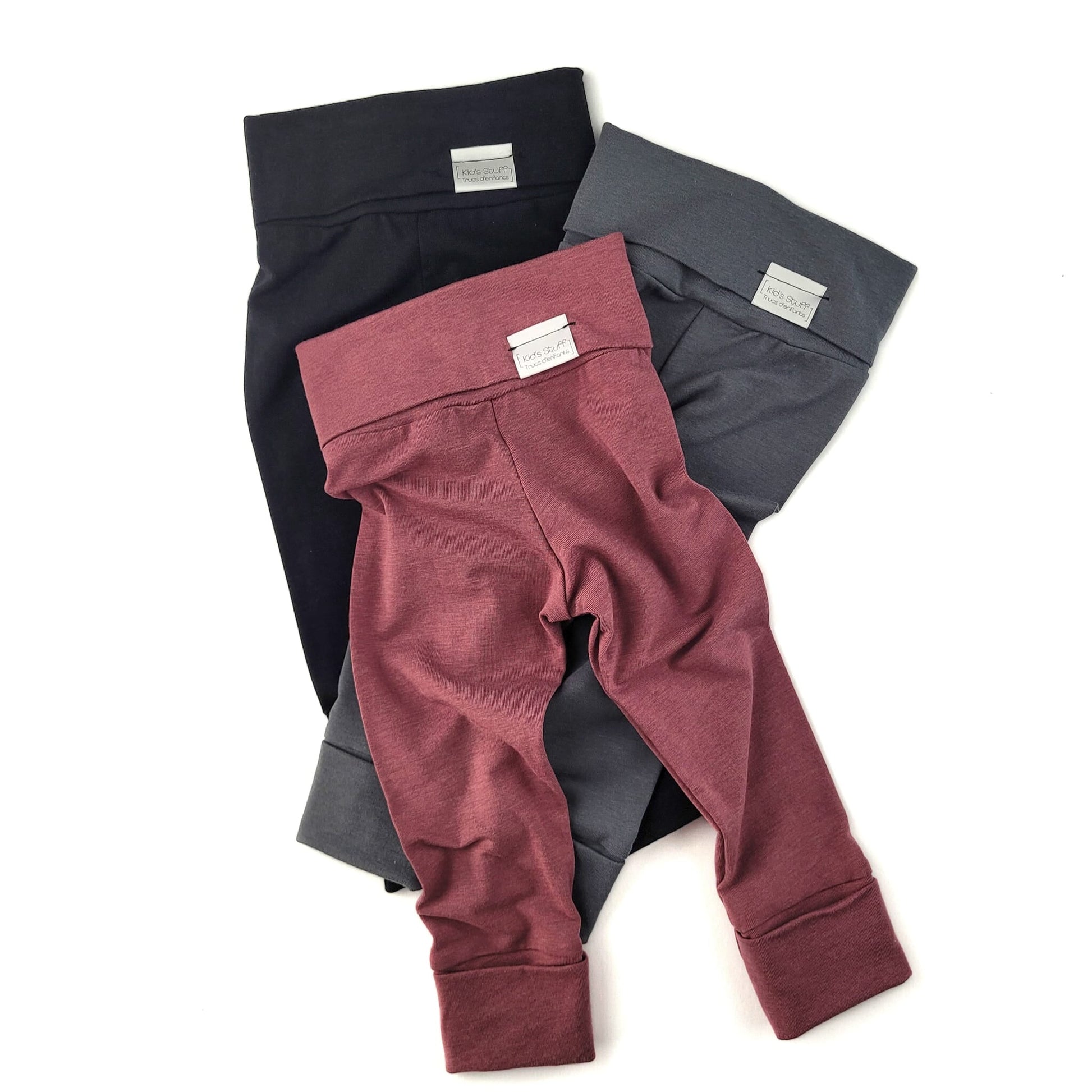 Black grow-with-me leggings for toddlers, made from soft, eco-friendly fabric. Adjustable waistband and cuffs for a long-lasting fit. Ethically made in Canada.