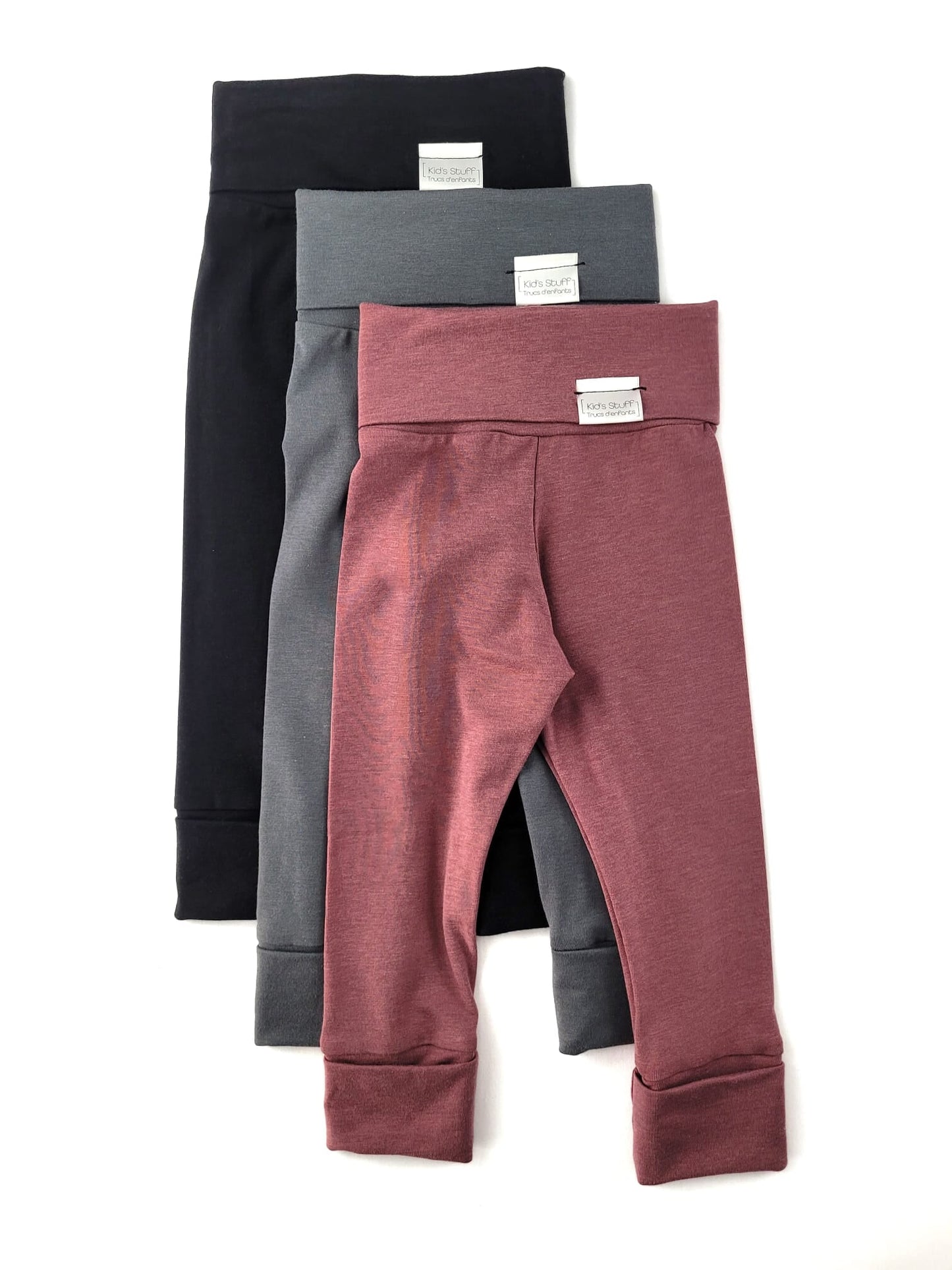 Black grow-with-me leggings for toddlers, made from soft, eco-friendly fabric. Adjustable waistband and cuffs for a long-lasting fit. Ethically made in Canada.