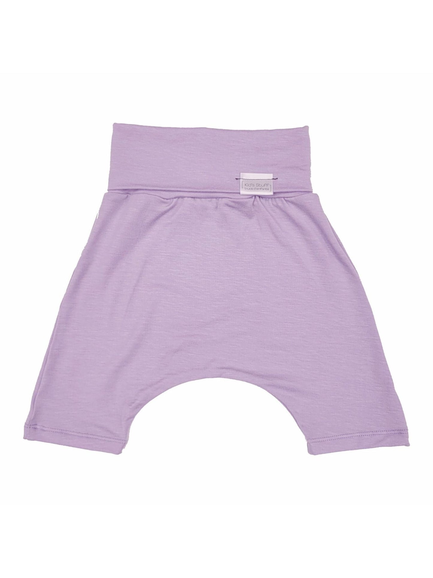 Waterlily grow-with-me shorts for kids, made from soft organic cotton with a stretchy, foldable waistband. Ethically made in Canada for a sustainable and comfy fit.