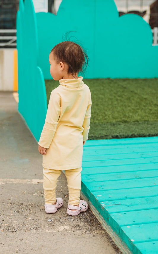 Eco-friendly kids' clothing – gender-neutral Honeysuckle Yellow grow with me turtleneck, sustainably made in Canada.