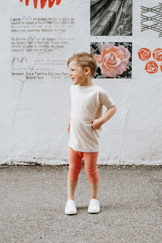 Heather Cream grow-with-me t-shirt for kids, made from soft Lyocell. Ethically made in Canada for a sustainable and comfy fit.