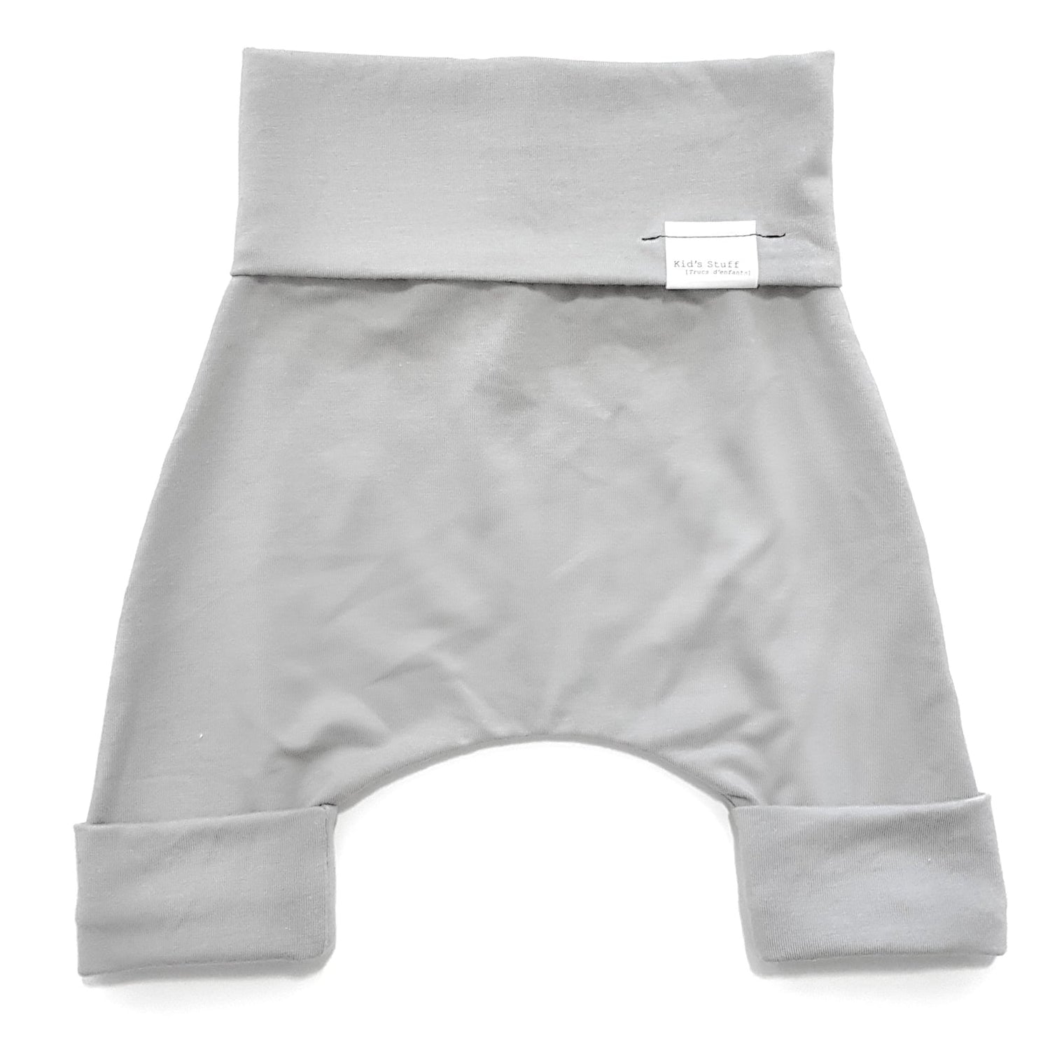 Taupe grow-with-me shorts for kids, made from soft organic cotton with a stretchy, foldable waistband. Ethically made in Canada for a sustainable and comfy fit.