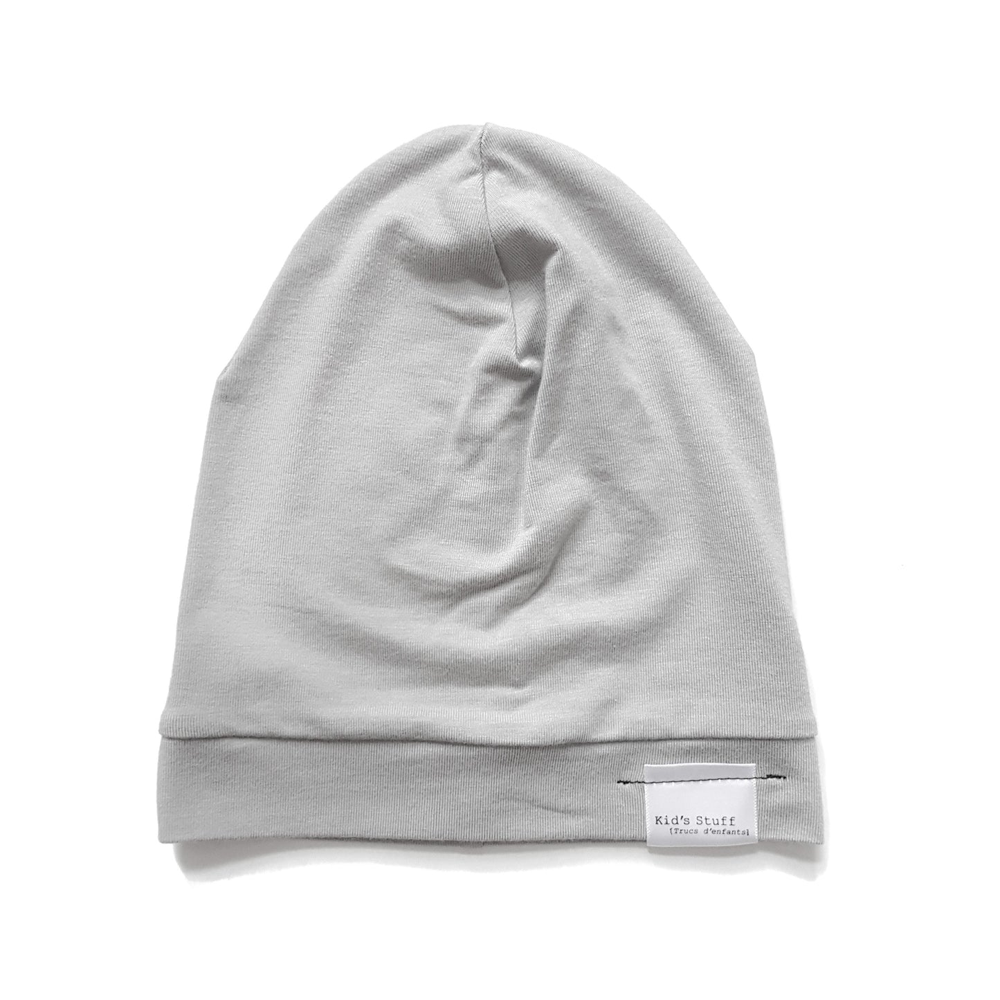 Soft and stretchy taupe beanie for kids, made from eco-friendly fabric. Ethically crafted in Canada, featuring a fold-over brim and minimalist design